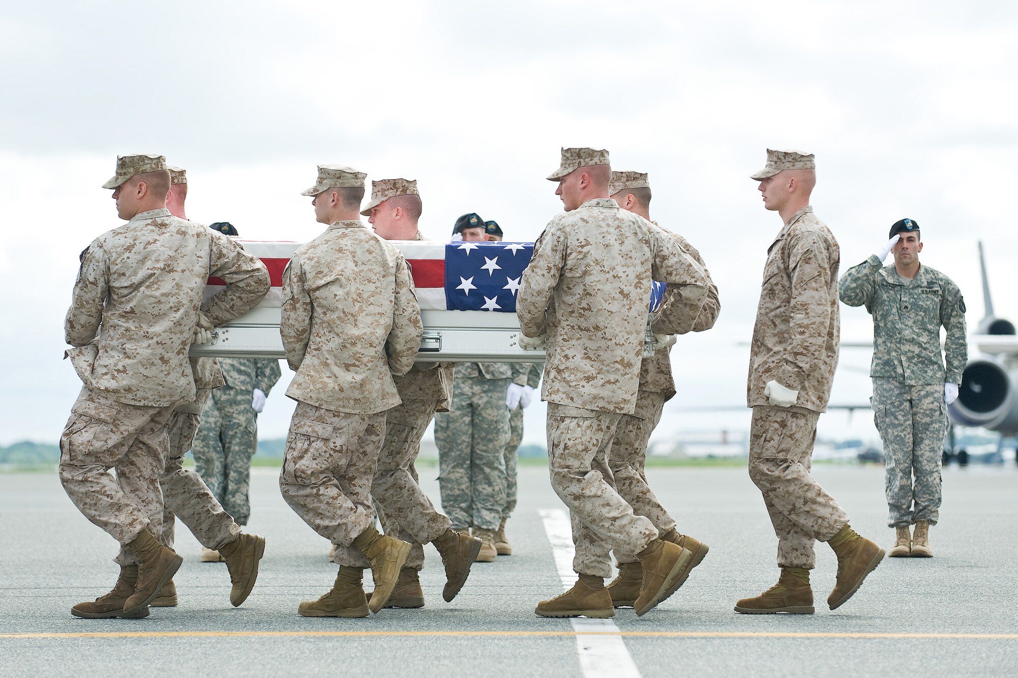 A U.S. Marine Corps team transfers the remains of Marine Corps Sgt. Jason D. Calo, of Lexington, Ky., at Dover Air Force Base, Del., Aug. 24. 2010. Calo was assigned to 2nd Battalion, 6th Marine Regiment, 2nd Marine Division, II Marine Expeditionary Force, Camp Lejeune, N.C.  (U.S. Air Force photo/Roland Balik)