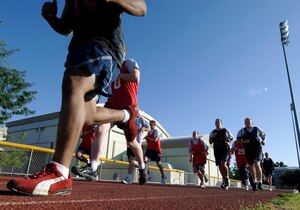 MOUNTAIN HOME AIR FORCE BASE, Idaho – Airmen perform the mile and a half run near the Mountain Home Fitness Center during a recent fitness test. The new test requires Airmen to be in even better combat readiness form.  Airmen must perform at least the minimum requirements in each category in order to pass. (U.S Air Force photo by Airman Samuel Anderson)