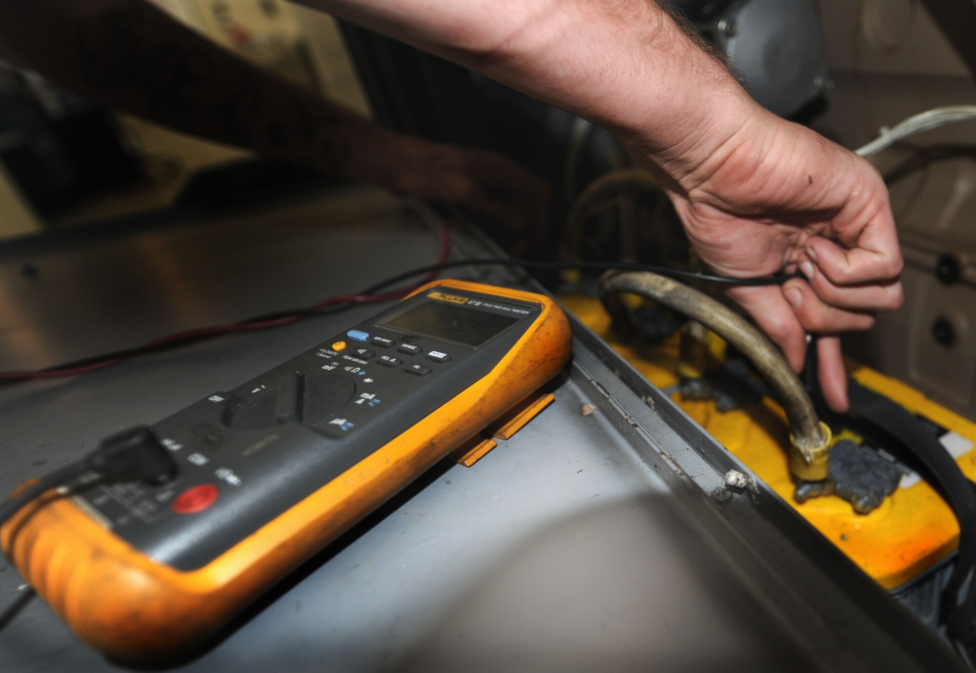 Senior Airman Aaron Hayden tests the battery voltage with a meter on a B809 generator for proper charging system operations during a semi-annual inspection on Joint Base Charleston, S.C., Sept. 2, 2010. The generator is used to power aircraft while they are stationary on the ground. Airman Hayden is an aerospace ground equipment apprentice with the 437 AGE. (U.S. Air Force Photo/Airman 1st Class Lauren Main)