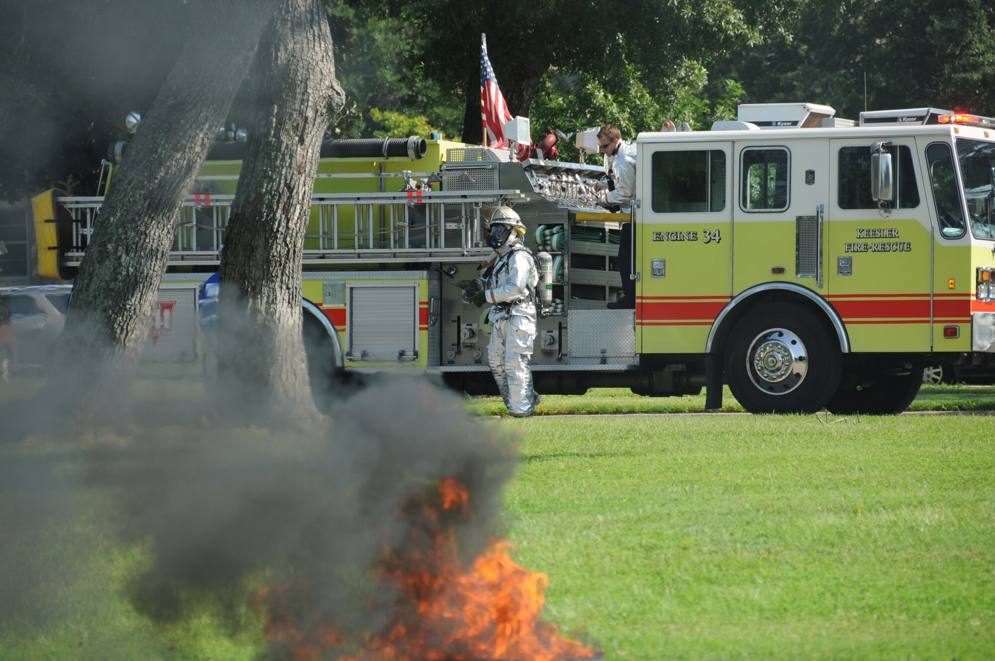 Keesler firefighters Staff Sgt. Commie Hobbs, left, and Jason Wallace arrive on scene.  (U.S. Air Force photo by Kemberly Groue)