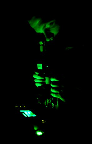 Senior Airman James McMillan runs through a spot and defects check on a pair of night vision goggles Sept. 1, 2010, on Joint Base Charleston, S.C. Checking for defects and spots in the NVGs is just as important as making sure they function in low-light situations. Spots and defects could lead to falsely identifying a target or missing a target putting the user in harms way. Night vision devices were first used in World War II and came into wide use during the Vietnam War. Airman McMillan is a NVG technician with the 437th Operations Support Squadron. (U.S. Air Force photo/Senior Airman Timothy Taylor)