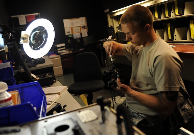 Senior Airman James McMillan replaces the seal on a pair of night vision goggles after replacing the nitrogen during an inspection Sept. 1, 2010, on Joint Base Charleston, S.C. The nitrogen helps amplify any available light allowing Airmen to operate or fly in extremely low light environments. The nitrogen also acts as a gas lubricant allowing the internal parts to move freely. The NVGs are inspected before and after flight and after 180 days. Airman McMillan is a NVG technician with the 437th Operations Support Squadron. (U.S. Air Force photo/Senior Airman Timothy Taylor)