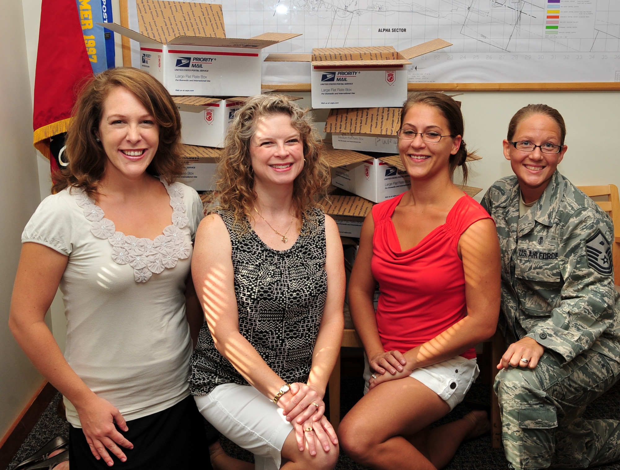 Lisa Weidmann, second from left, mentor of the Civil Engineer
“Key Spouse Program” said the focus of their group is to “keep
families connected”. Other key members shown include (left to
right) Erika Golart, Lisa Waters and Master Sgt. Krystal Marks,
CE First Sergeant. (Photo by Jennifer Macklin)
