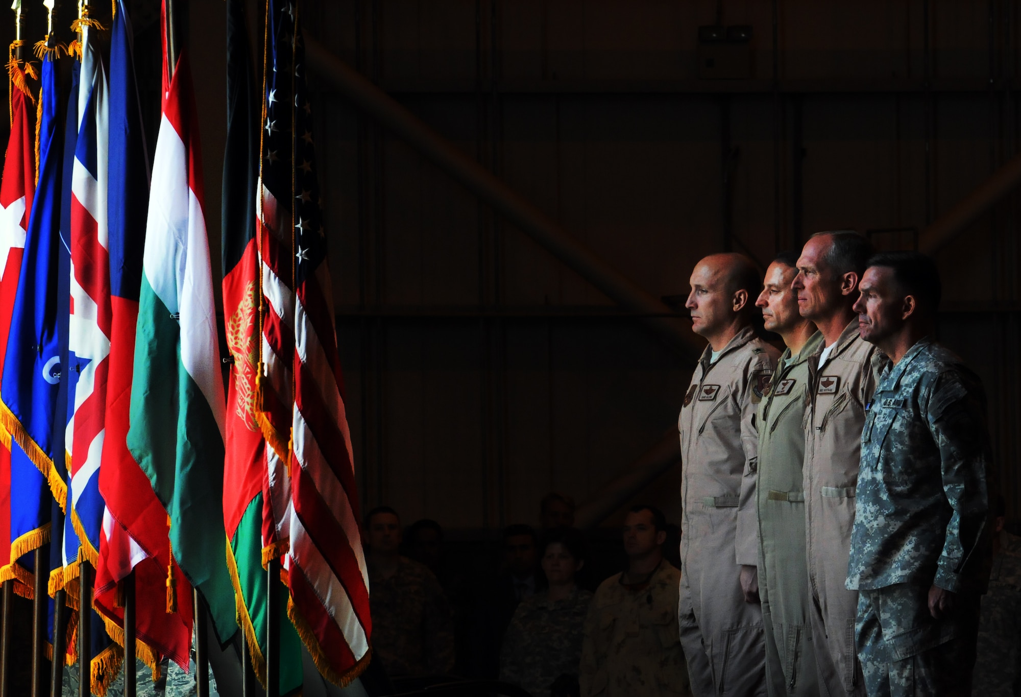 100907-N-6031Q-001 KABUL, Afghanistan -Brig. Gen. David W. Allvin, Commanding General, 438th Air Expeditionary Wing, NATO Air Training Command- Afghanistan, left, Brig. Gen. Michael Boera, Commanding General Combined Air Power Transition Force, Lt. Gen. Gilmary Hostage, Commander, U.S. Air Forces Central Command, Southwest Asia, and Lt. Gen. William B. Caldwell, Commanding General, NATO Training Mission and Combined Security Transition Command - Afghanistan, stand at attention for the national anthems of Afghanistan and the United States during the change of command ceremony between Boera and Allvin held on the Afghan Air Force base in Kabul, Afghanistan on Sep. 7, 2010. The change of command from Boera to Allvin marks the end of CAPTF and the beginning of the newly name NATC-A.(US Navy photo by Mass Communication Specialist 2nd Class David Quillen/ RELEASED).