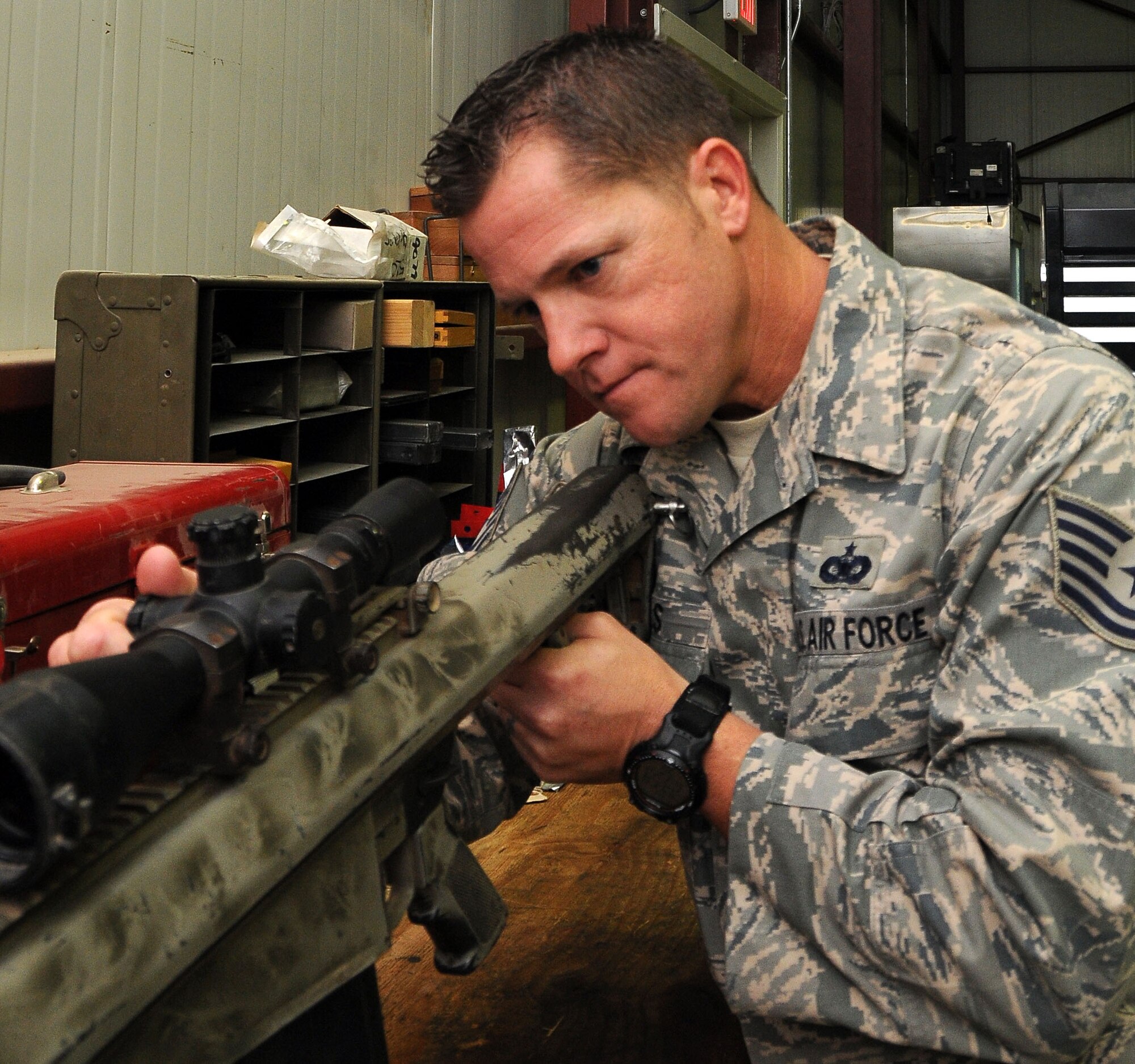 Tech. Sgt. Sean Nichols, 332nd Expeditionary Security Forces Squadron armory non-commissioned officer in charge, inspects an M-107 long-range sniper rifle Sept. 6, 2010, Joint Base Balad, Iraq. The M-107 is a .50 caliber rifle with attached optics/electro-optics that supports all weather conditions in day or night operations it is armor penetrating and has a maximum range of 7,450 yards. Sergeant Nichols is deployed from Hickam Air Force Base, Hawaii, and a native of Fullerton, Calif. (U.S. Air Force photo/Senior Airman Marianne E. Lane)
