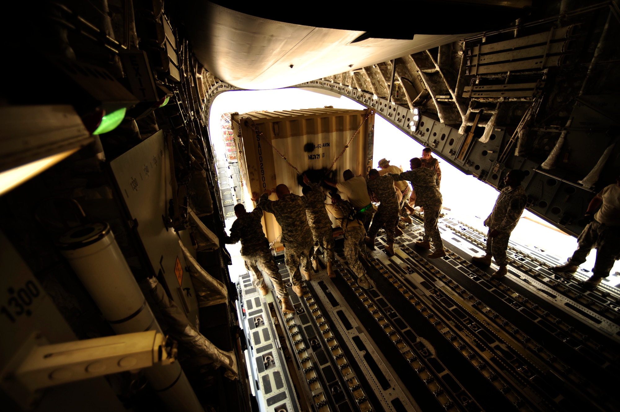 U.S. Air Force airmen from the 818th Contingency Response Element and U.S. Army soldiers from the 16th Combat Aviation Brigade, take the straps off of UH-60 Blackhawk helicopters and cargo aboard a C-17 Globemaster III aircraft at Chaklala Air Force Base, Pakistan on Sept. 1, 2010. The 16th CAB just arrived in Pakistan and are going to air transport supplies throughout the country.
(U.S. Air Force photo by Staff Sgt. Andy M. Kin / Released)