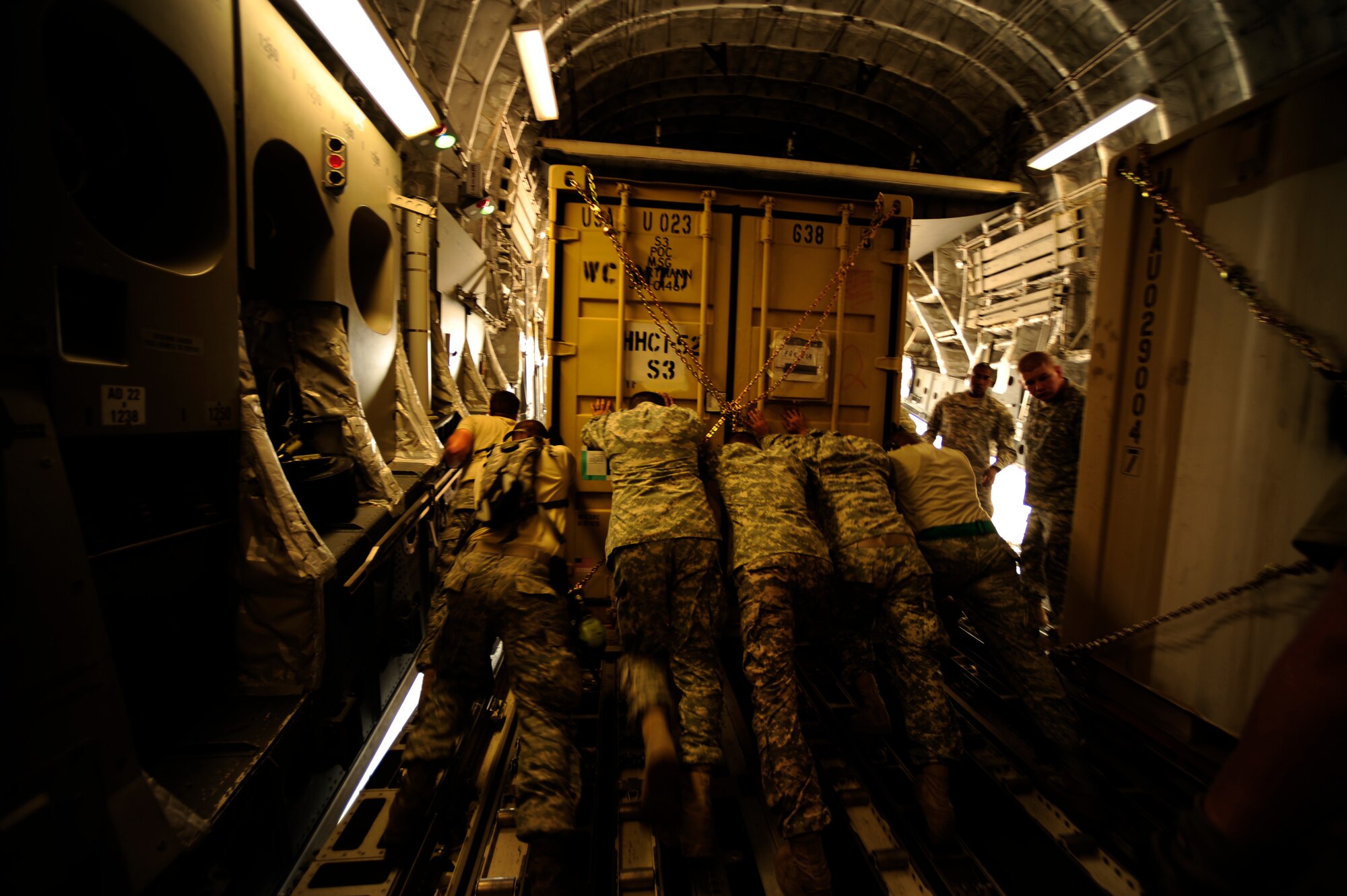 U.S. Air Force airmen from the 818th Contingency Response Element and U.S. Army soldiers from the 16th Combat Aviation Brigade, take the straps off of UH-60 Blackhawk helicopters and cargo aboard a C-17 Globemaster III aircraft at Chaklala Air Force Base, Pakistan on Sept. 1, 2010. The 16th CAB just arrived in Pakistan and are going to air transport supplies throughout the country.
(U.S. Air Force photo by Staff Sgt. Andy M. Kin / Released)