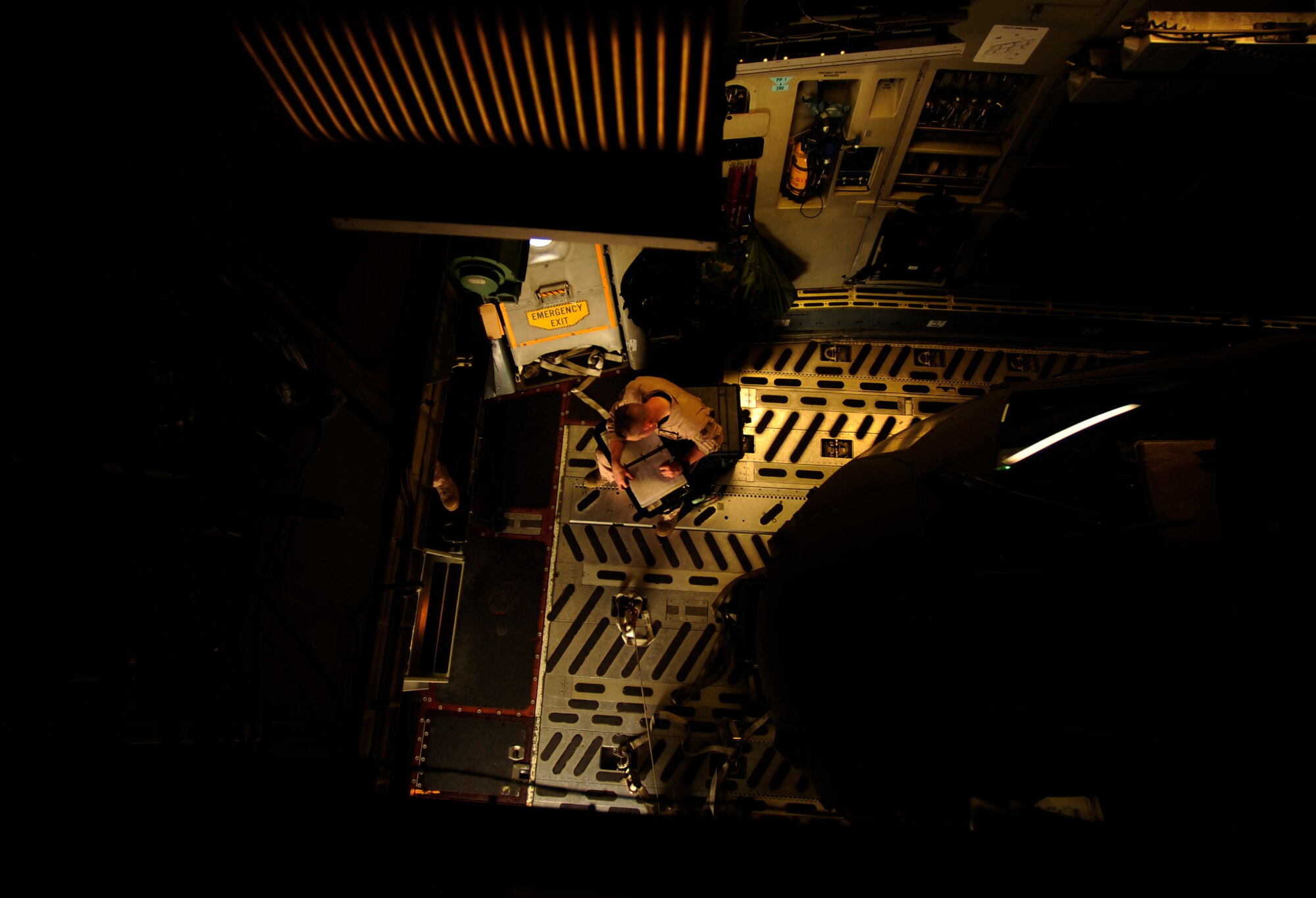 U.S. Air Force loadmaster from the 517th Airlift Squadron, Elmendorf Air Force Base, Ak., fills out paperwork after landing in Chaklala Air Force Base, Pakistan on Sept. 1, 2010.
(U.S. Air Force photo by Staff Sgt. Andy M. Kin / Released)