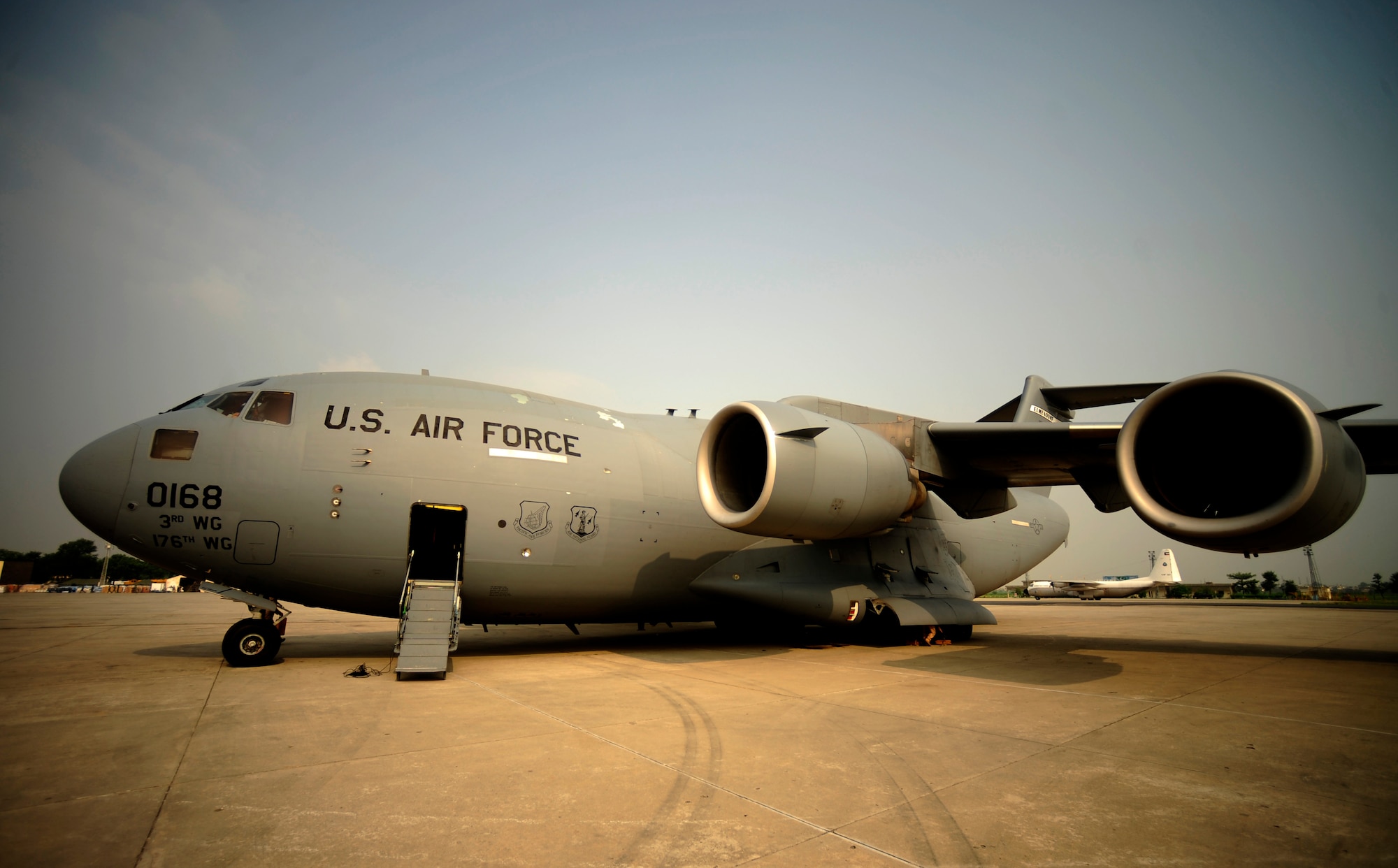 U.S. Air Force C-17 Globemaster III aircraft assigned to the 517th Airlift Squadron Elmendorf Air Force Base, Alaska, arrives at Chaklala Air Force Base, Pakistan, with members of the 16th Combat Aviation Brigade, Ft. Wainwright, Alaska, in support of flood relief efforts on Sept. 1, 2010. The 16th CAB brought in two UH-60 Blackhawk helicopters along with personnel for upcoming relief efforts.
(U.S. Air Force photo by Staff Sgt. Andy M. Kin / Released)