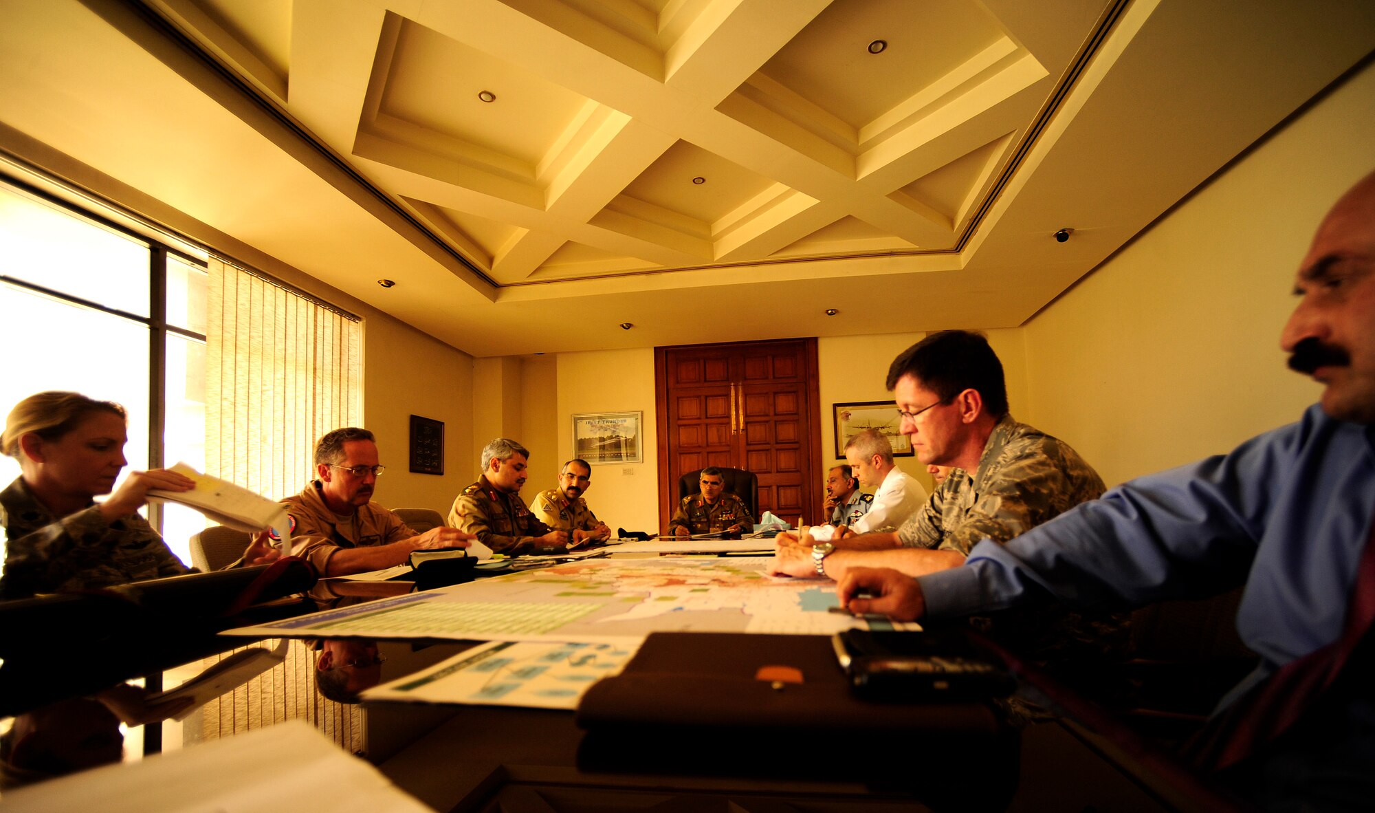 Pakistan Maj. Gen Arif, commander of the Army Aviation Command (center), heads an Air Coordination Cell meeting with many U.S., Pakistan, and international organizations aimed at flood relief efforts in Pakistan. The ACC was formed to discuss available food and supply requirements needed in flooded areas throughout Pakistan and means for transporting items throughout the country.(U.S. photo taken by Staff Sgt. Andy M. Kin)