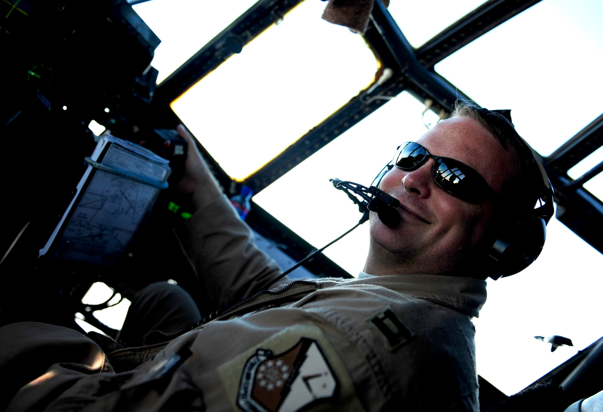 U.S. Air Force Capt. Jeremy Corner a C-130H Hercules pilot assigned to the 746th Expeditionary Airlift Squadron, poses for the camera during a flying mission to Chaklala Air Force Base, Pakistan in support of humanitarian relief efforts on Aug. 25, 2010. 
(U.S. Air Force photo by Staff Sgt. Andy M. Kin / Released)  