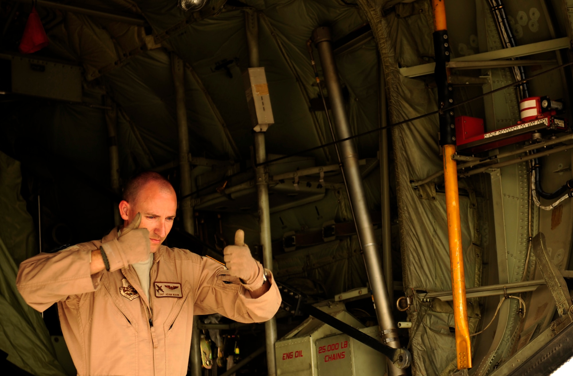 U.S. Air Force Tech Sgt. Adam Nixon a C-130H Hercules loadmaster assigned to  the 746th Expeditionary Airlift Squadron, instructs the forklift technician to "move up" during cargo off load at Chaklala Air Force Base, Pakistan  in support of humanitarian relief efforts on Aug. 22, 2010. The 746th EAS is staged out of Bagram Airfield, Afghanistan during operations.
(U.S. Air Force photo by Staff Sgt. Andy M. Kin / Released)