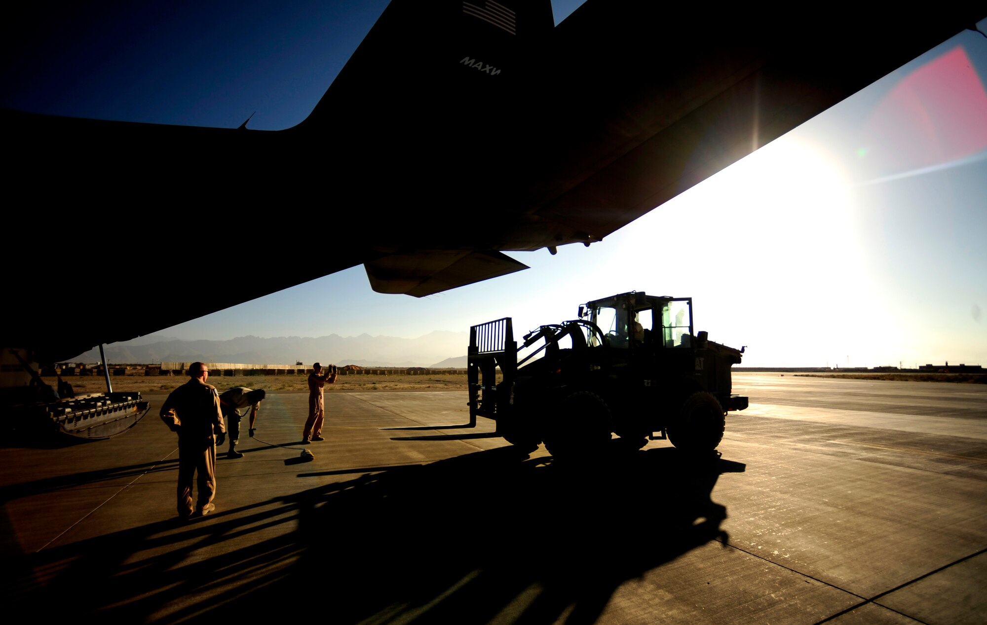 U.S. Air Force Tech. Sgts Owen Duke Jr. and Adam Nixon C-130H Hercules loadmasters assigned to the 746th Expeditionary Airlift Squadron, on load cargo headed to Chaklala Air Force Base, Pakistan in support of humanitarian relief efforts from Bagram Airfield, Afghanistan on Aug. 22, 2010. 
(U.S. Air Force photo by Staff Sgt. Andy M. Kin / Released)