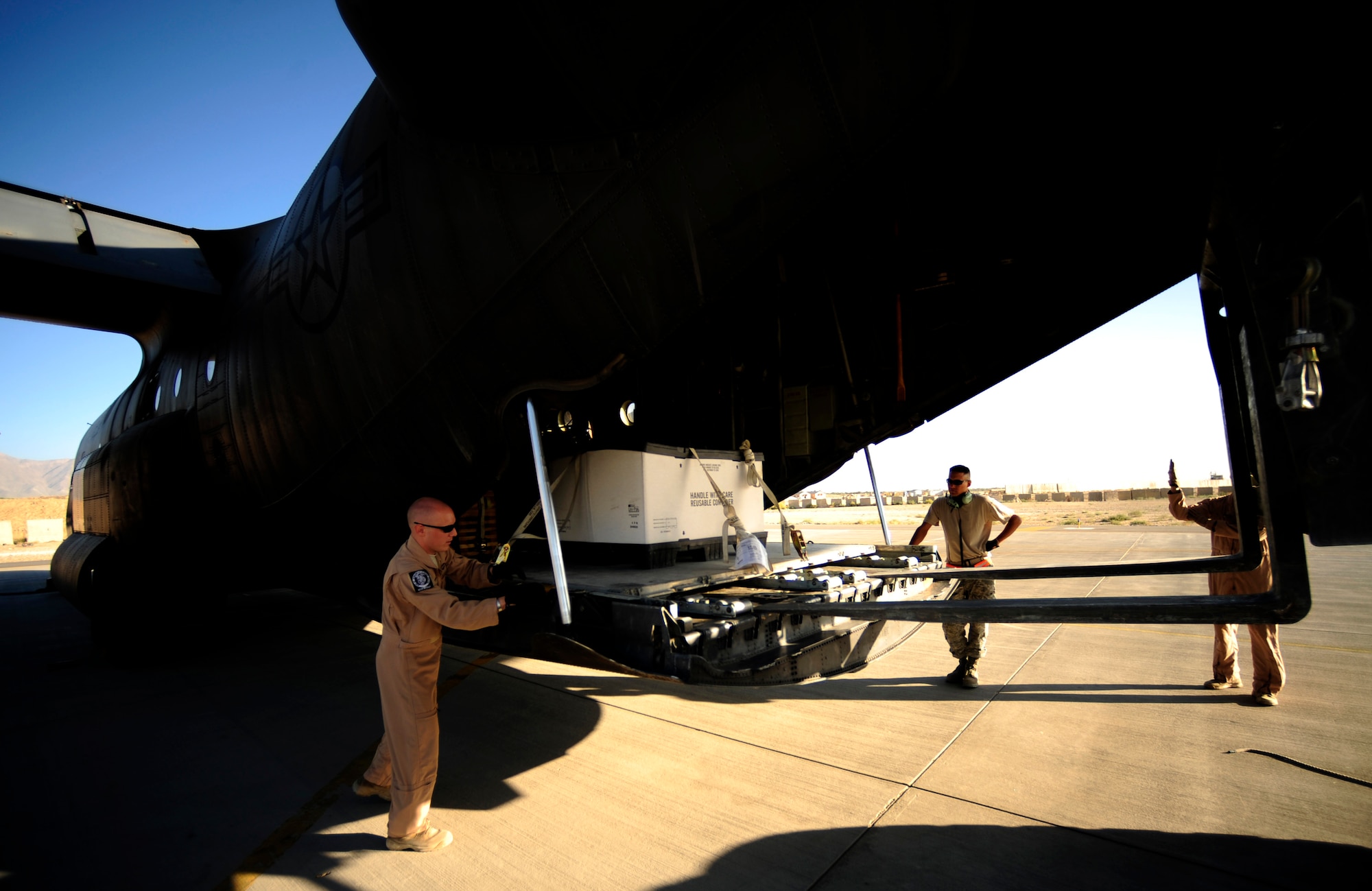 U.S. Air Force Tech. Sgts Owen Duke Jr. and Adam Nixon C-130H Hercules loadmasters assigned to the 746th Expeditionary Airlift Squadron, on load cargo headed to Pakistan in support of humanitarian relief efforts from Bagram Airfield, Afghanistan on Aug. 22, 2010. 
(U.S. Air Force photo by Staff Sgt. Andy M. Kin / Released)