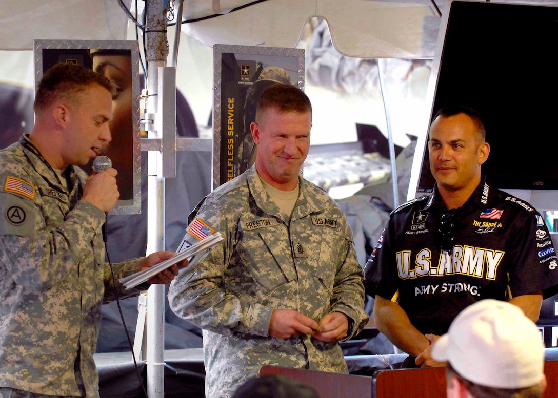 Sgt. Maj. of the Army Kenneth O. Preston prepares to promote Tony Schumacher to his new honorary rank of Sergeant 1st Class during the unveiling ceremony of  the Army's new dragster, at the O'Reilly Raceway Park, in Indianapolis, Sept. 3, 2010. The Army dragster finished the race with a speed of 324.83 mph, setting a new speed record at the park. Schumaker's nickname at the track is "The Sarge."