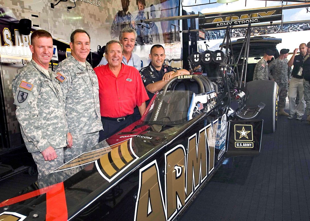 U.S. Army Sgt. Maj. of the Army Kenneth O. Preston, U.S. Army Accessions Command Commanding General Lt. Gen. Benjamin Freakley, U.S. Army Racing Team owner Don Schumacher, National Hot Rod Association President Bob Compton and seven-time world champion Tony “The Sarge” Schumacher stand with the new U.S. Army dragster at O’Reilly Raceway Park in Indianapolis, Sept. 3, 2010. 