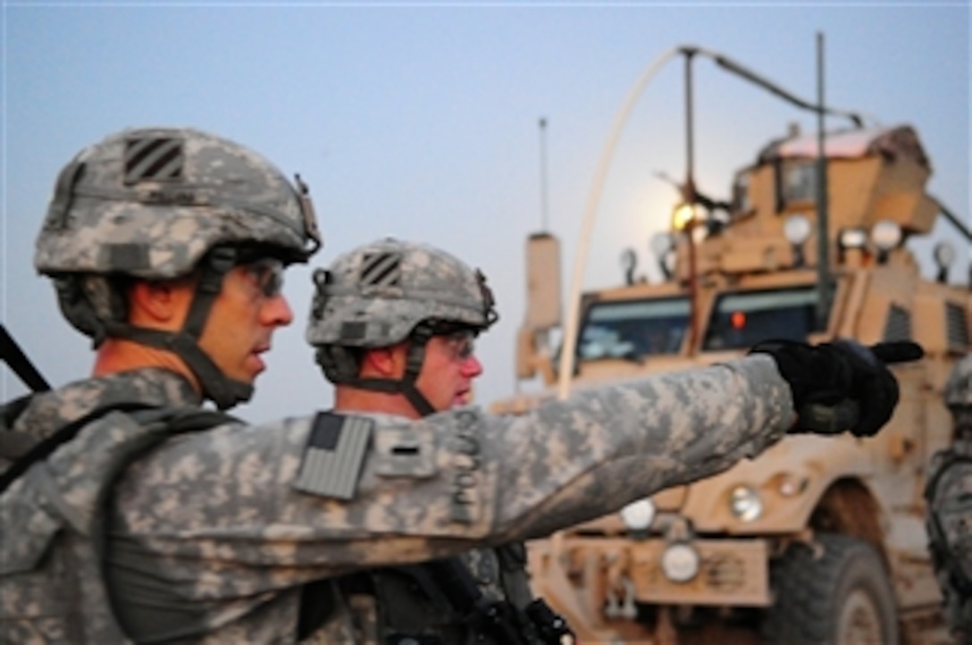 U.S. Army soldiers with Delta Troop, 3rd Squadron, 7th Cavalry Regiment, 2nd Heavy Brigade Combat Team, 3rd Infantry Division search for weapons caches in Mosul, Iraq, on Aug. 25, 2010.  