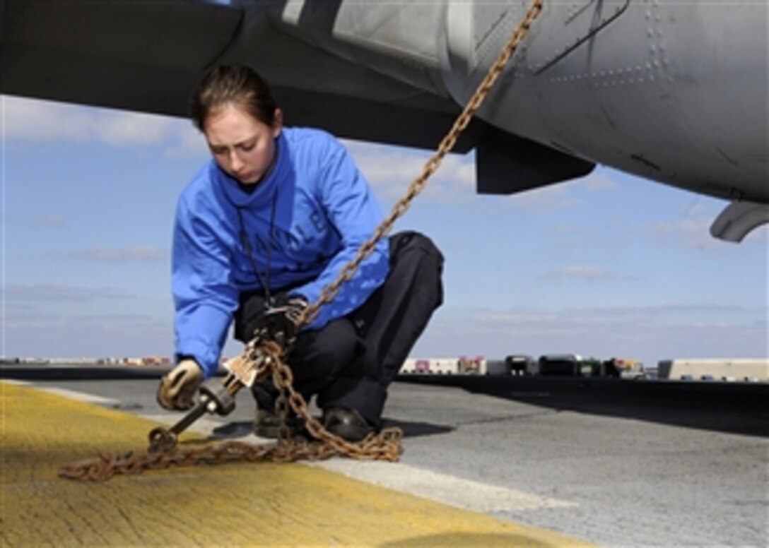 U.S. Navy Airman Christiana Sanchez uses chains to secure an MV-22B Osprey aircraft to the flight deck of the amphibious assault ship USS Kearsarge (LHD 3) while the ship is underway in the Atlantic Ocean on Aug. 31, 2010.  The Kearsarge Amphibious Ready Group and U.S. Marines with the 26th Marine Expeditionary Unit were en route to Pakistan to provide flood relief assistance to citizens of that nation.  