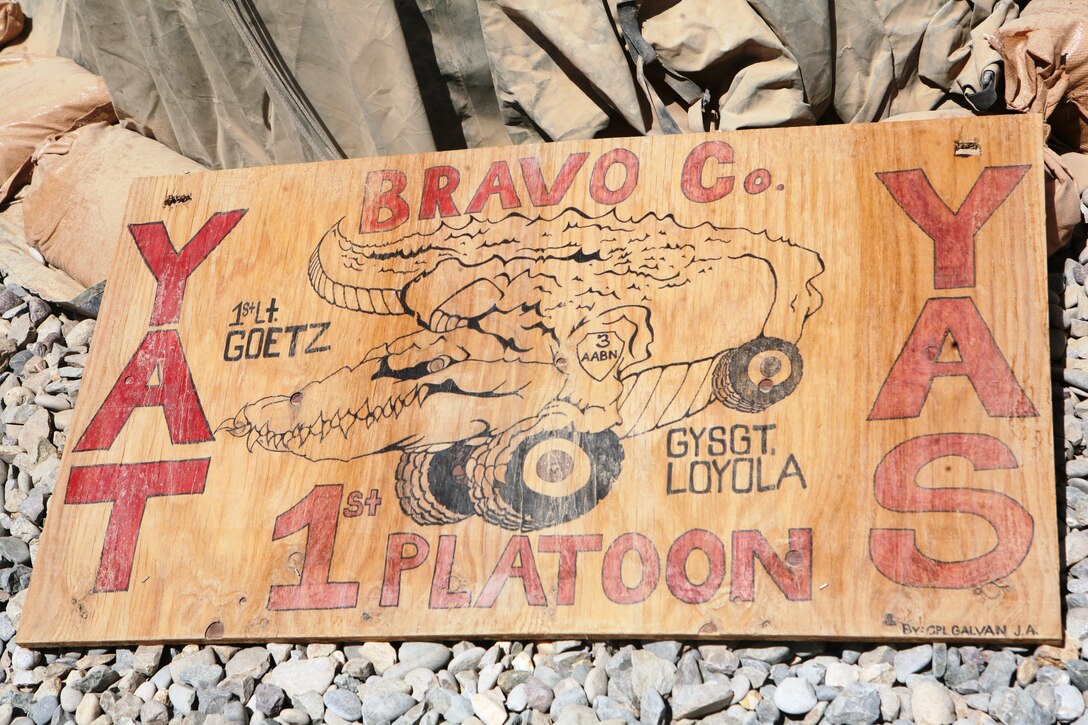 Cpl. John A. Galvan, an assistant squad leader with Mine Resistant Ambush Protected Company, 3rd Amphibious Assault Battalion, drew his unit logo poster for his tents as a show of unit pride when the company first got to Marjah. This led to Galvan painting two Afghan flags with a sponge, Q-tips and his fingers.