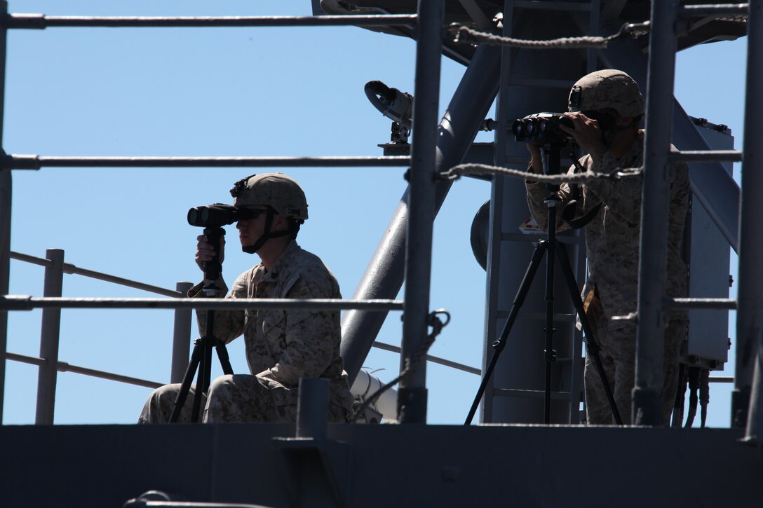 Marines with 26th Marine Expeditionary Unit provide overwatch aboard USS Kearsarge as the ships of Kearsarge Amphibious Ready Group make their way toward the Strait of Gibraltar, Sept. 8, 2010. 26th MEU deployed aboard the ships of Kearsarge ARG in late August responding to an order by the Secretary of Defense to support Pakistan flood relief efforts.