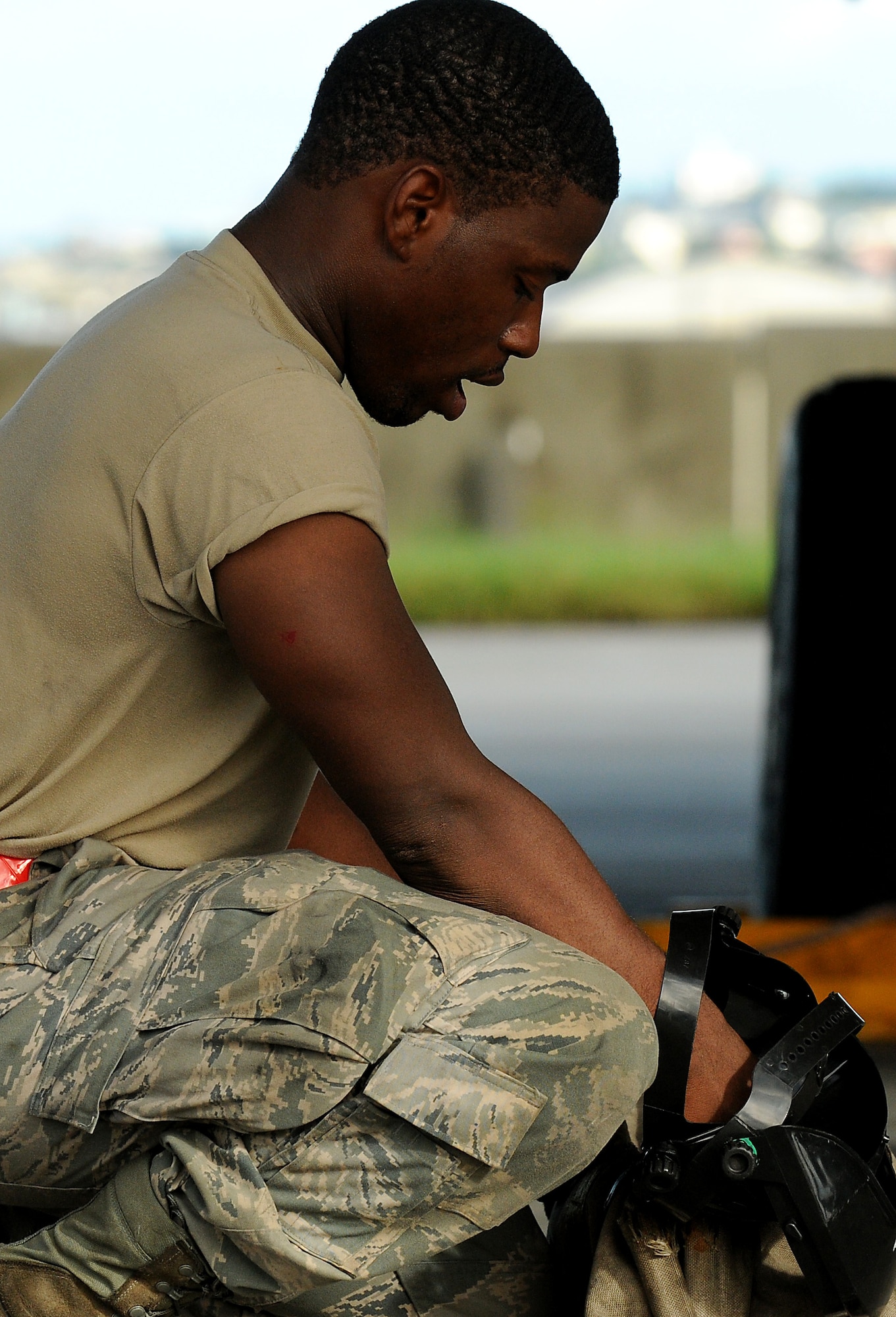 Airman 1st Class Tyrus Johnson, a crew chief with the 67th Aircraft Maintenance Unit, gathers equipment used to prepare an F-15 to depart for Valiiant Shield, Sept. 8. More than 18 aircraft and 600 Kadena members deployed in support of the bi-annual operation. (US Air Force photo/Staff Sgt. Christopher Hummel)