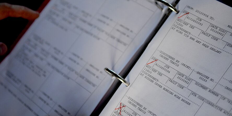 A 67th Aircraft Maintenance Unit member reviews forms before an aircraft departs for a joint training exercise, Sept. 8. Aircraft maintenance forms like these are reviewed daily to ensure proper care is taken of each F-15 at Kadena. (US Air Force photo/Staff Sgt. Christopher Hummel)