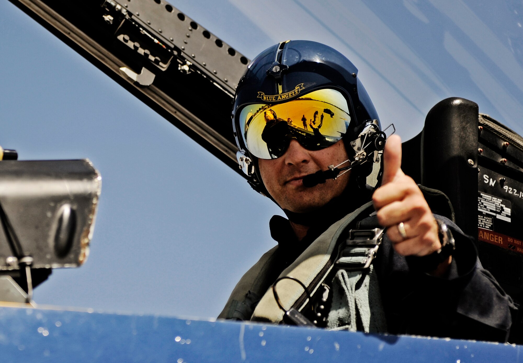 Farrell Shelton, high school history teacher and football coach poses for a picture in the back of the Blue Angel #7 jet Sept 8 at Scott AFB. The U.S. Navy in conjunction with the Scott Air Force Base air show, Airpower Over the Midwest, took two community leaders and one member of the media on orientation flights in an F/A-18 Hornet around the greater Scott area to give them a taste of what it?s like to be a military fighter pilot. (U.S. Air Force photo/ Staff Sgt. Ryan Crane)