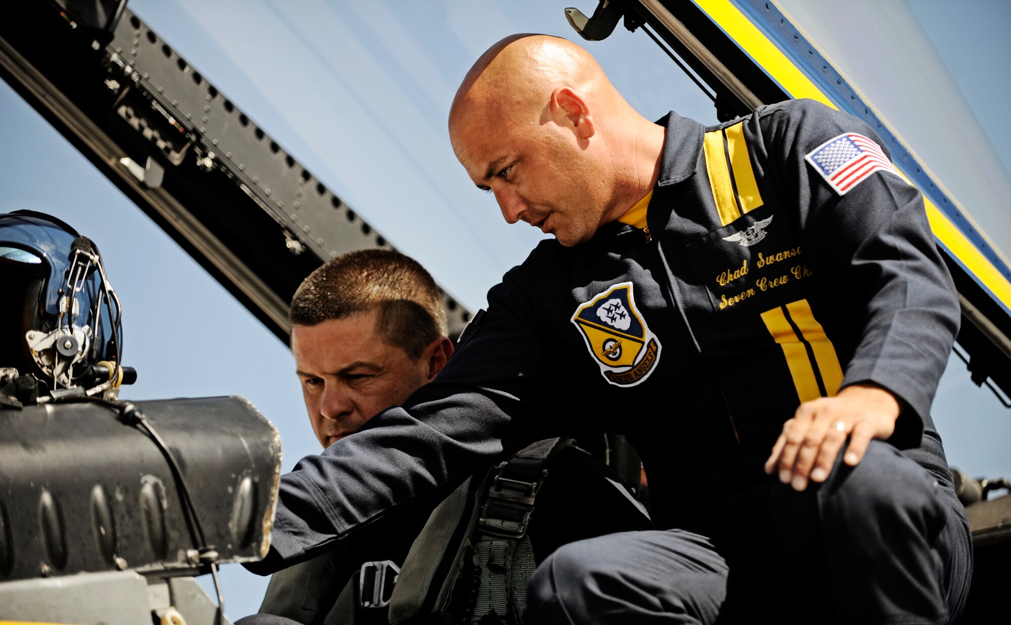 Petty Officer Chad Swanson, Blue Angels #7 crew chief, instructs Farrell Shelton, high school history teacher and football coach how to control the volume in his headset Sept. 8 at Scott AFB. The U.S. Navy in conjunction with the Scott Air Force Base air show, Airpower Over the Midwest, took two community leaders and one member of the media on orientation flights in an F/A-18 Hornet around the greater Scott area to give them a taste of what it?s like to be a military fighter pilot. (U.S. Air Force photo/ Staff Sgt. Ryan Crane)