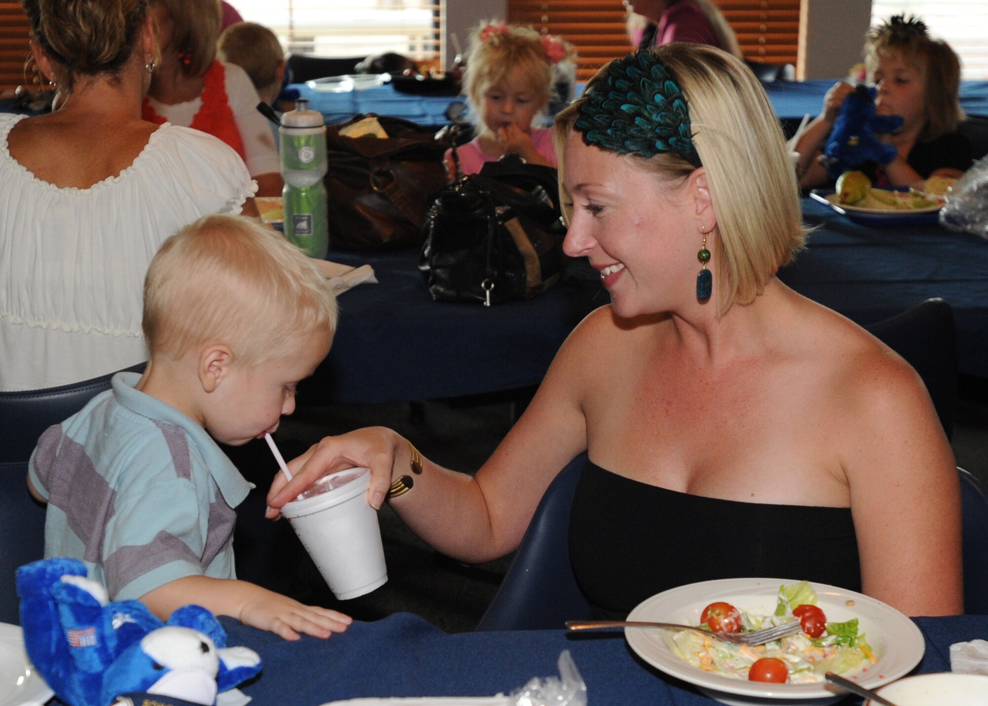 Stephanie Boman and her son, Ethan Boman, enjoy an evening out during the Deployed Remote Family Meal at the Pecos Trail dining facility Sept. 7. The dinner included raffles and prize giveaways. (U.S. Air Force photo by Senior Airman Maynelinne De La Cruz) 
