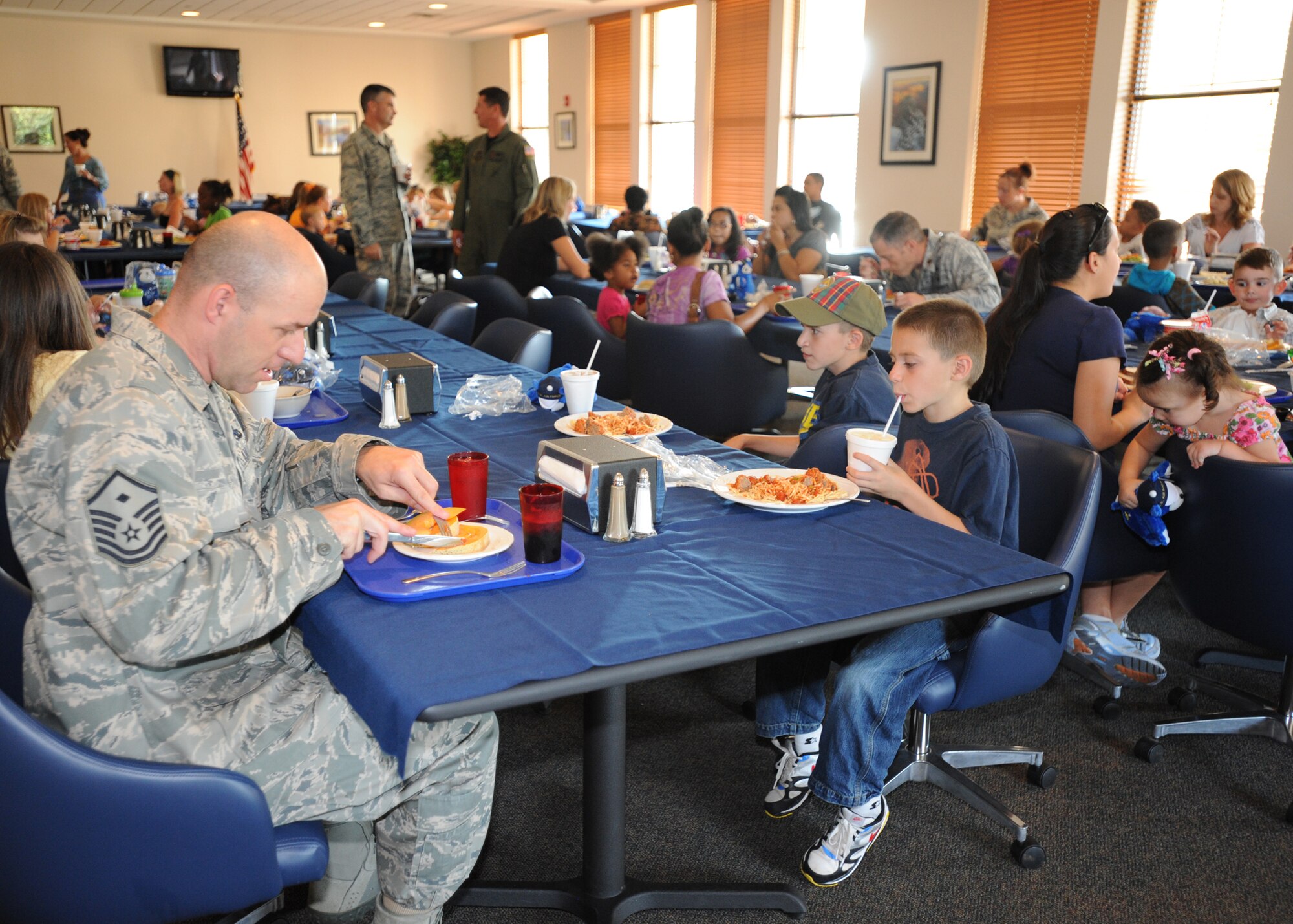 During the Deployed Remote Family Meal, families of deployed spouses came together to dine and enjoy each other's company Sept. 7 at the Pecos Trail Dining Facility. The night included drawings for prizesand also gave families a chance to meet each other. (U.S. Air Force photo by Senior Airman Maynelinne De La Cruz) 