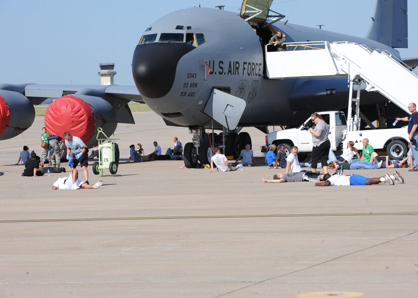 Team McConnell and community members participate in a Major Accident Response Exercise Sept. 1, 2010, to prepare for the upcoming Open House and Air Show Sept. 25 and 26, McConnell Air Force Base, Kan.  The exercise prepared emergency services members from McConnell, Sedgwick County responders, the American Red Cross and three local hospitals.  (U.S. Air Force photo/Airman 1st Class Andrea Salazar)