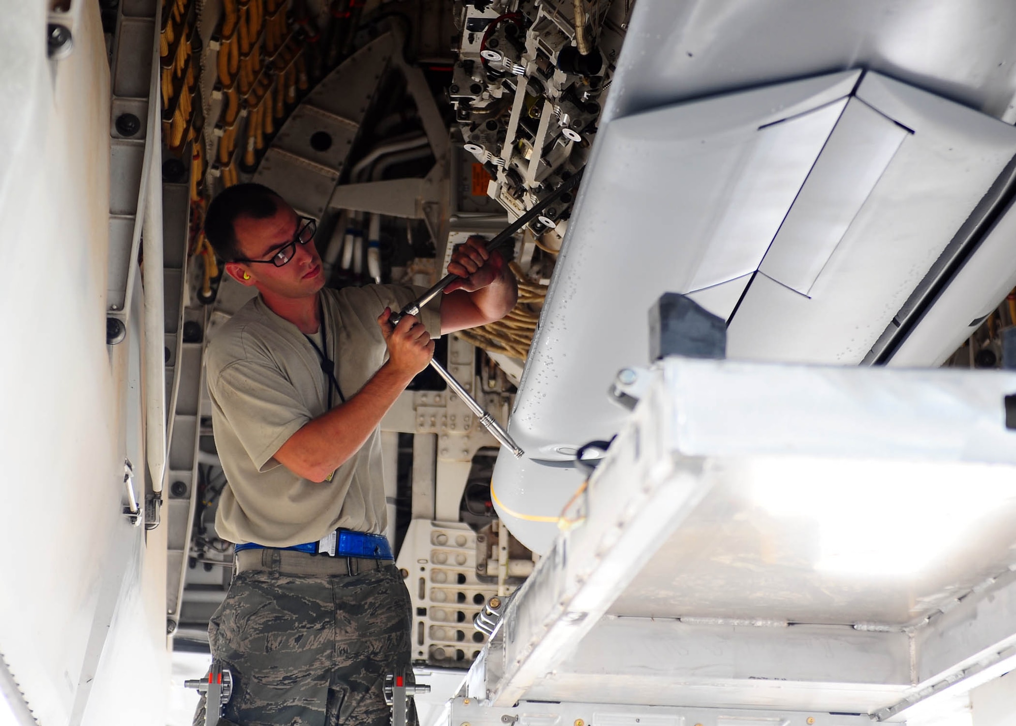 DYESS AIR FORCE BASE, Texas—Staff Sgt. Cedric DeBourbon, 7th Airlift Maintenance Squadron, makes final adjustments prior to loading the JASSMs Sept. 7 here. A Dyess Air Force Base B-1 Bomber carried a full load of 24 AGM-158 Joint Air to Surface Standoff Missiles on a five-hour flight into the Gulf of Mexico Sept. 7, a first for the B-1 and AGM-158. The purpose of the flight was to ensure maintainers, ammo and munitions troops, and B-1 aircrew are proficient in uploading, flying, employing and downloading the AGM-158 JASSM, and to test all missile-related processes to see if there’s any room for improvement. None of the missiles were released during this test; they were system-checked while in the air. JASSM is a standoff missile designed to keep the jet and its crew a significant distance away from surface to air threats while still holding an enemy’s targets at risk. (Photo by Airman 1st Class Brittney Smolinski)