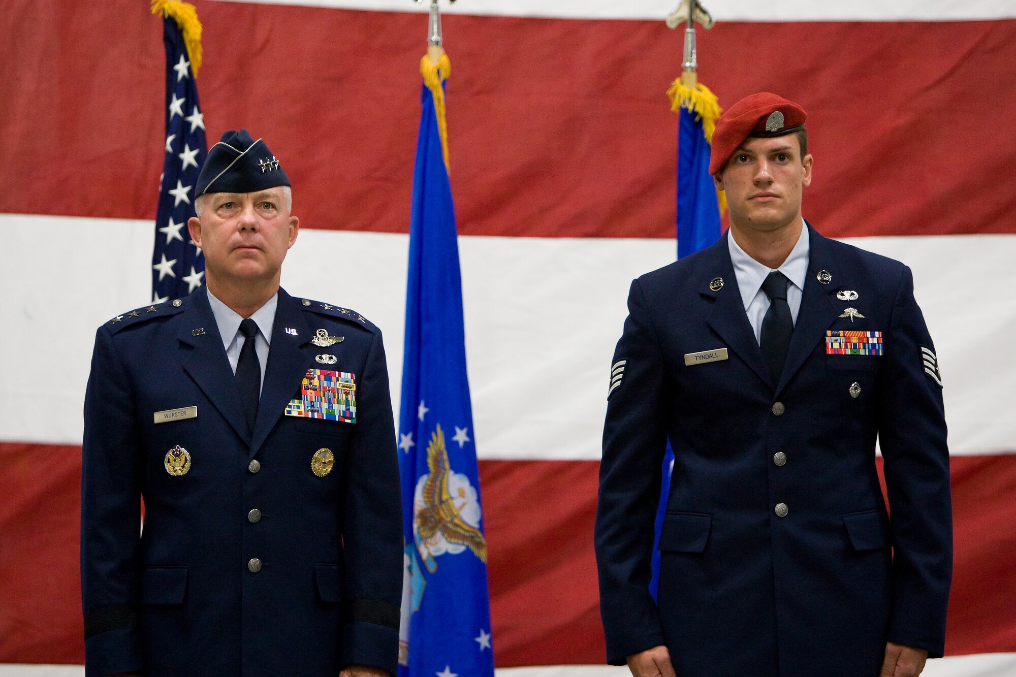 Lt. Gen. Donald Wurster, left, Air Force Special Operations Command commander, and Staff Sgt. Christopher Tyndall, 22nd Special Tactics Squadron combat controller, stand at attention during an award ceremony Sept. 8 at Joint Base Lewis-McChord, Wash. Sergeant Tyndall recieved a Purple Heart for wounds sustained in action March 30 in support of Operation ENDURING FREEDOM. (U.S. Air Force Photo/2nd Lt. John Wylie)