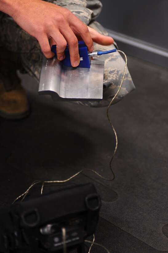 ELLSWORTH AIR FORCE BASE, S.D. - Senior Airman Evan Bryant, 28th Maintenance Squadron non-destructive inspection technician, calibrates Eddy Current Equipment by using a test piece Sept. 2. Airman Bryant prepares to do a routine inspection on B-1B Lancer landing gear wheels. (U.S. Air Force photo/Senior Airman Kasey Close)
