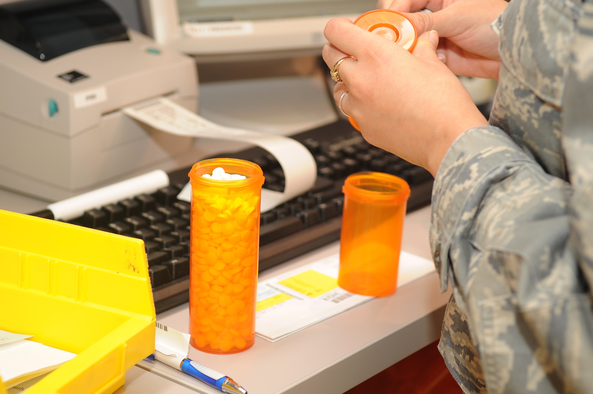 BUCKLEY AIR FORCE BASE, Colo. -- Airman 1st Class Christina Caputo, 460th Medical Group, refills prescriptions at the new base pharmacy, Sept. (U.S. Air Force photo by Airman Manisha Vasquez) 