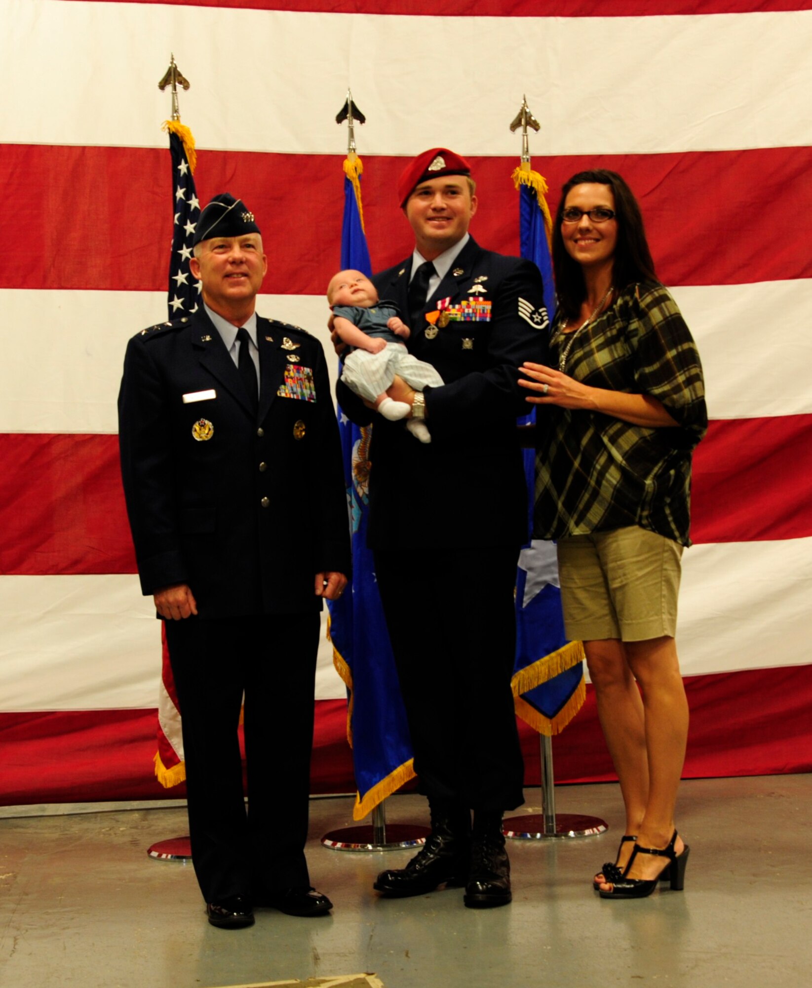 Lt. Gen. Donald Wurster, Air Force Special Operations Command commander, joins Staff Sgt. Michael Orlando, 22nd Special Tactics Squadron combat controller, in an award ceremony Sept. 8 at Joint Base Lewis-McChord, Wash. (U.S. Air Force Photo/Airman Leah Young)