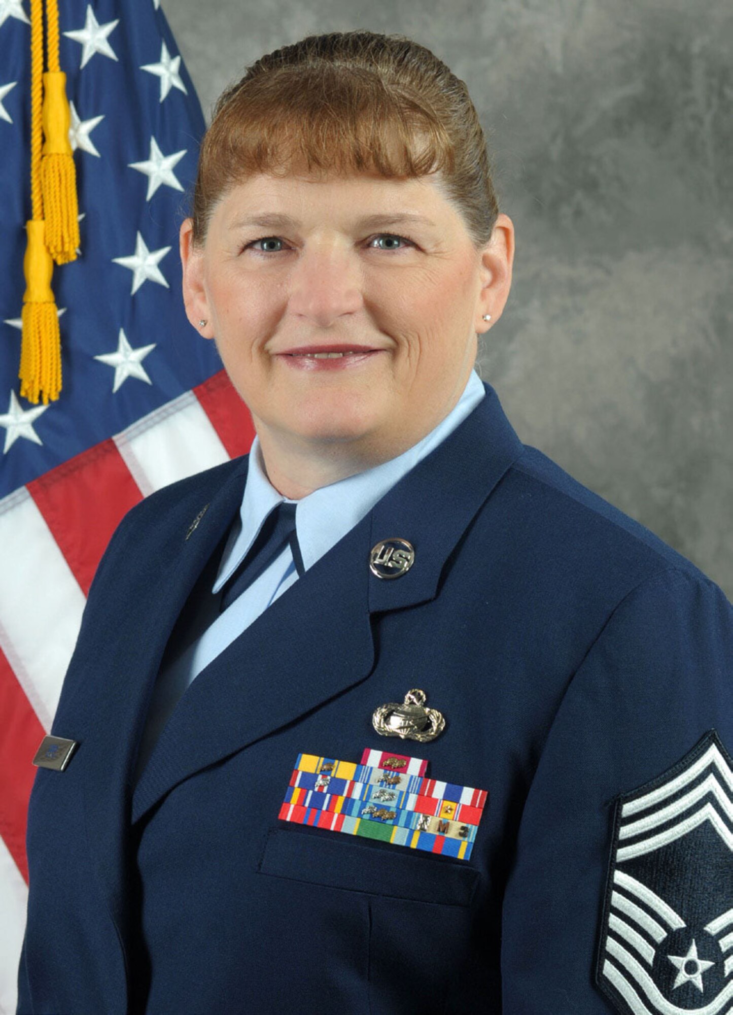 Chief Master Sgt. Sharlotte Epps poses for her final official photo.  (U.S. Air Force photo/100908-f-2222J-001)