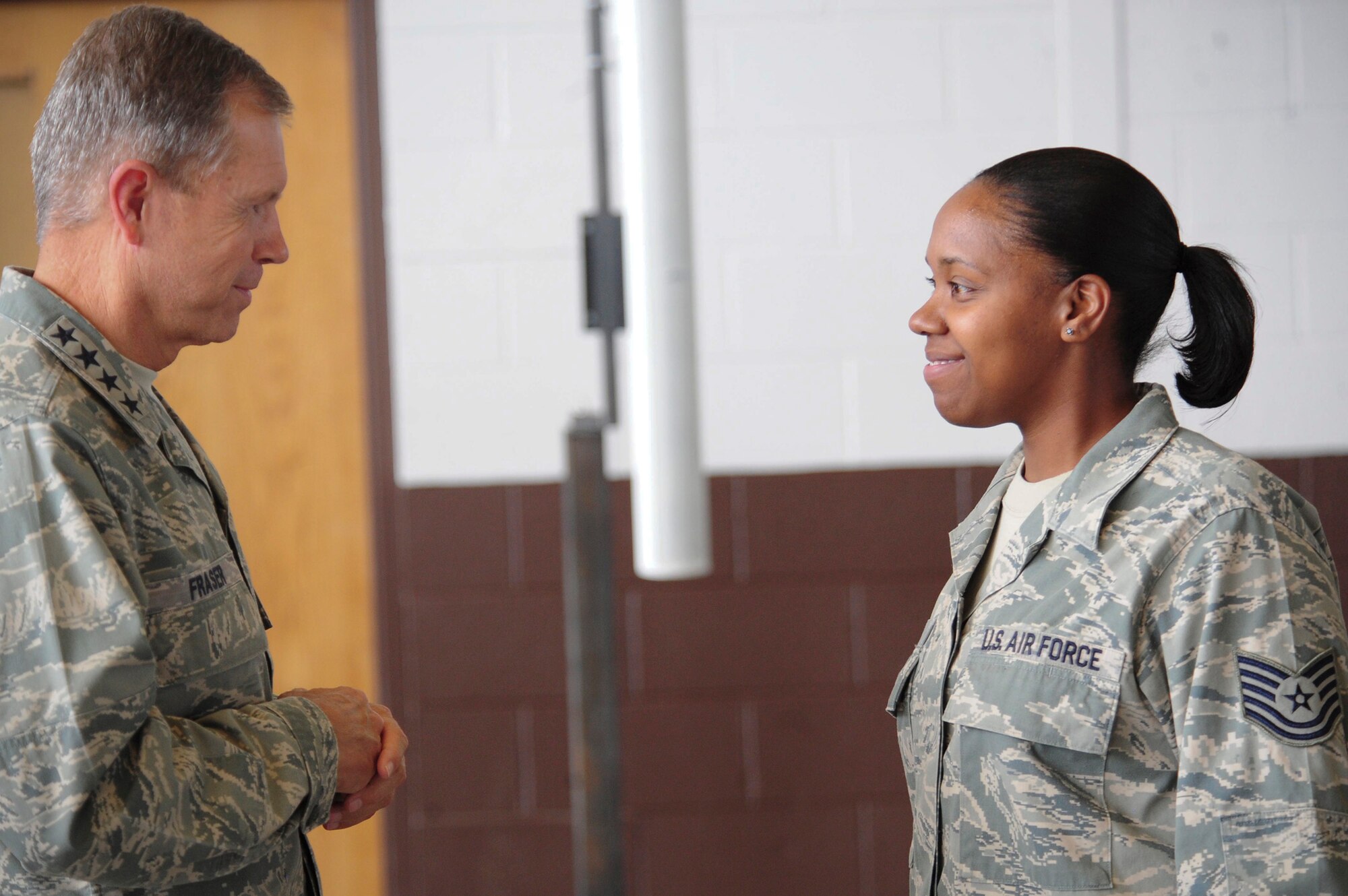 Gen. William M. Fraser III speaks to Tech. Sgt. Angela Baker after a commander's call Sept. 1, 2010, at Ellsworth Air Force Base, S.D. General Fraser answered questions from Airmen during and after the commander's call. General Fraser is the commander of Air Combat Command. Sergeant Baker is the 28th Medical Group administration services NCO in charge. (U.S. Air Force photo/Senior Airman Corey Hook)






