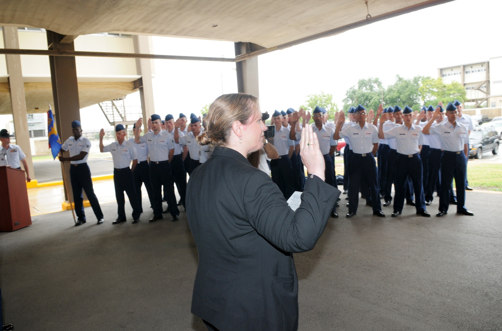 Erin Conaton, Under Secretary of the Air Force , administers the oath to an Air Force Trainee graduating class. Secretary Conaton visited Sept. 3 to acknowledge Lackland Air Force Base and the Wilford Hall Hospital mission.  (U.S. Air Force photo by Joel Martinez)