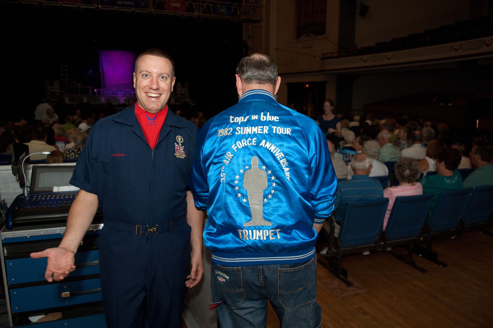 LOWELL, Mass. – Tech. Sgt. Matthew Flowers, a member of the Tops in Blue technical staff, stands next to a former 1982 Tops in Blue trumpet player prior to the show on Sept. 1. The U.S. Air Force’s traveling entertainment group performed for a crowded theater at Lowell Memorial Auditorium. The theme was “We Believe.” (U.S. Air Force photo by Rick Berry)