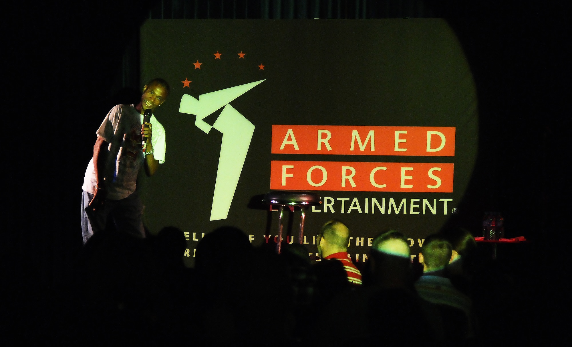 Comedian Tommy Davidson performs stand-up comedy for approximately 300 Incirlik personnel August 24, 2010 at Incirlik Air Base, Turkey.  Davidson and comedian Robert Maher brought laughter to the Incirlik community as part of an Armed Force Entertainment tour where they spent a day visiting with Airmen, signing autographs and closing out with stand up performances.  (U.S. Air Force photo by Senior Airman Alexandre Montes/Released)