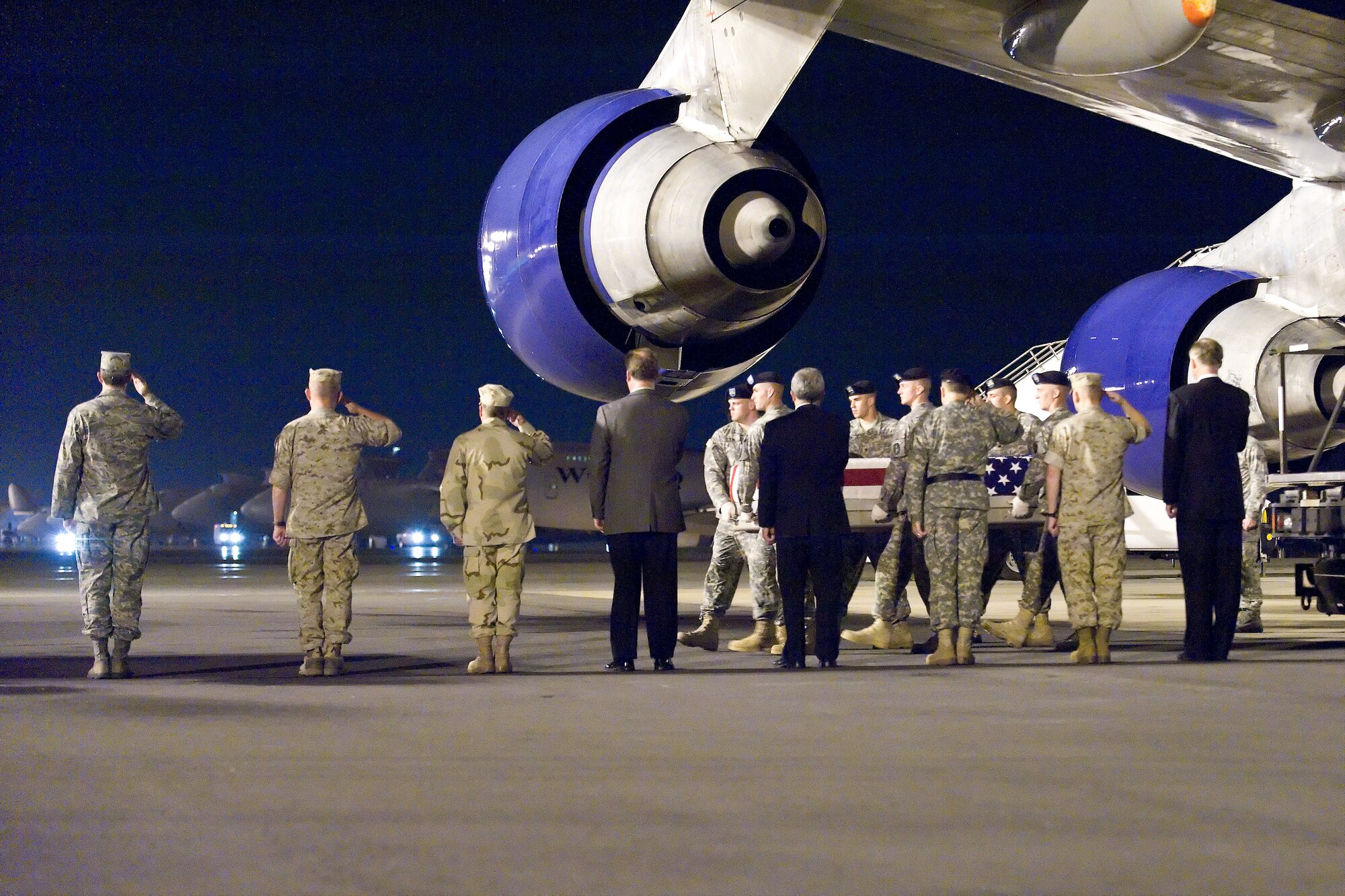 A U.S. Army carry team transfers the remains of Army Pfc. Chad D. Clements, of Huntington, Ind., at Dover Air Force Base, Del., Sept. 1, 2010. Clements was assigned to the 4th Brigade Support Battalion, 1st Brigade Combat Team, 4th Infantry Division, Fort Carson, Colo. (U.S. Air Force photo/Roland Balik)