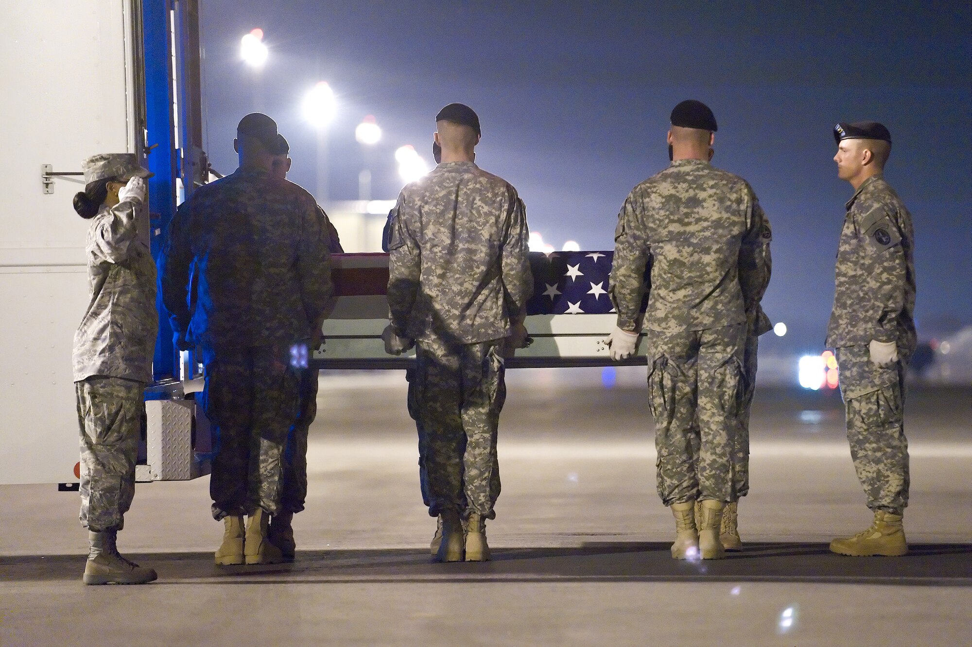 A U.S. Army carry team transfers the remains of Army Sgt. Vinson Adkinson, at Dover Air Force Base, Del., Sept. 1, 2010. (U.S. Air Force photo/Roland Balik)