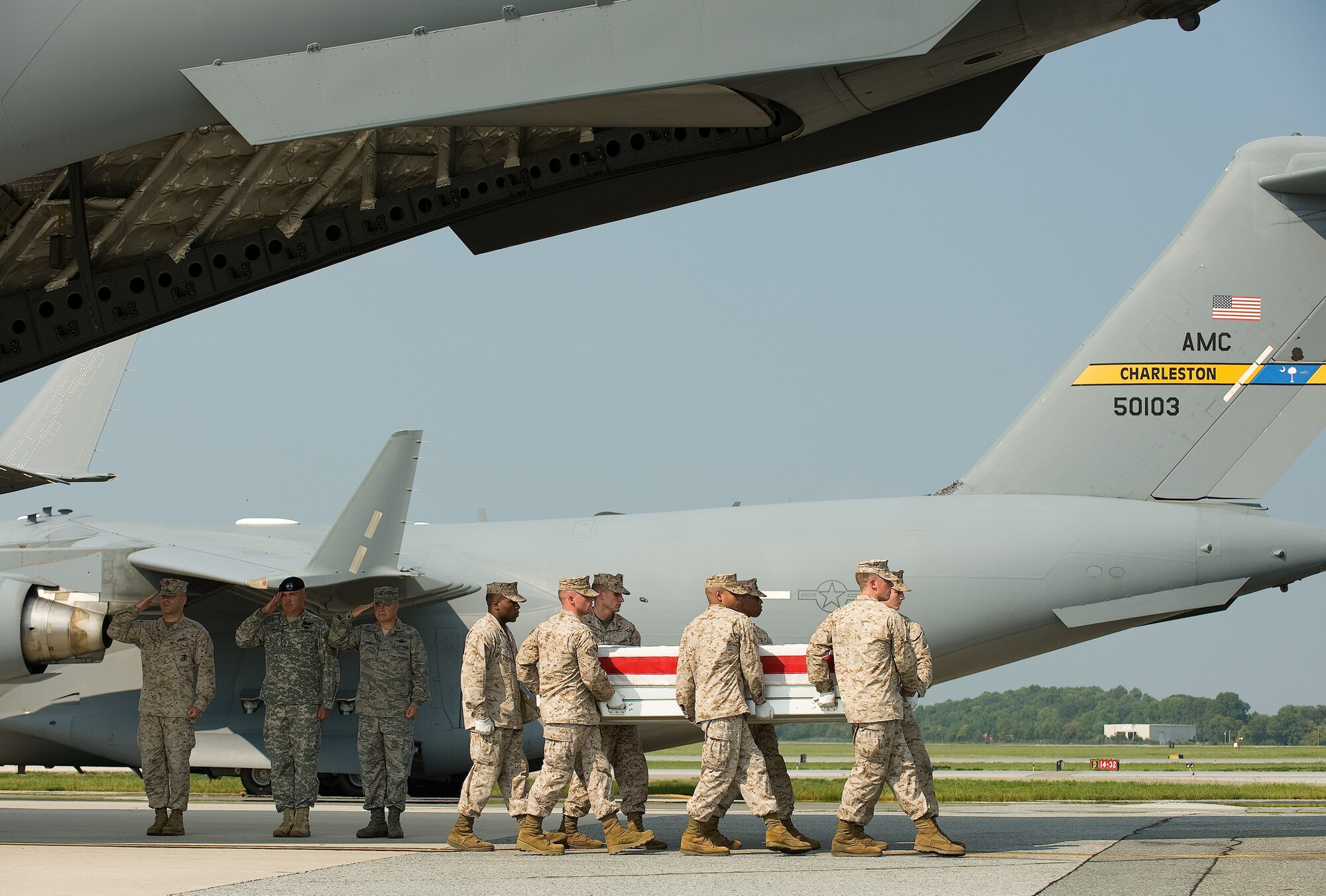A U.S. Marine Corps carry team transfers the remains of Marine Gunnery Sgt. Floyd E. Holley of Orlando, Fla., at Dover Air Force Base, Del., Aug. 31, 2010.  Holley was assigned to 1st Battalion, 11th Marine Regiment, 1st Marine Division, I Marine Expeditionary Force, Camp Pendleton, Calif. He died Aug. 23 while supporting combat operations in Helmand province, Afghanistan. (U.S. Air Force photo/Jason Minto)