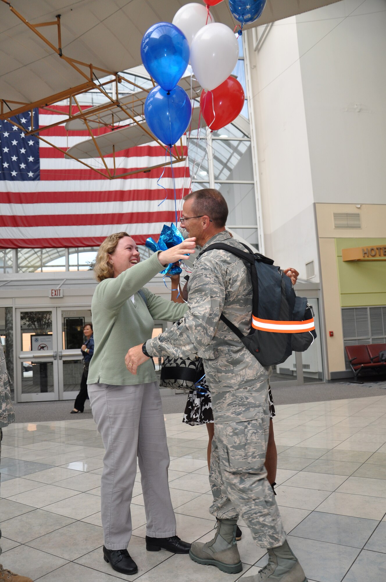 WRIGHT-PATTERSON AIR FORCE BASE, Ohio – Capt. Rodney McNany, 445th Airlift Wing Public Affairs, is greeted by Ms. Stacy Vaughn, 445th Airlift Wing Public Affairs, at the Dayton International Airport Sept. 7 after returning from a 6-month deployment to Southwest Asia. Captain McNany was assigned to the Joint Operations Center for United States Forces, Iraq.  (U.S. Air Force photo/Maj. Jose Cardenas)