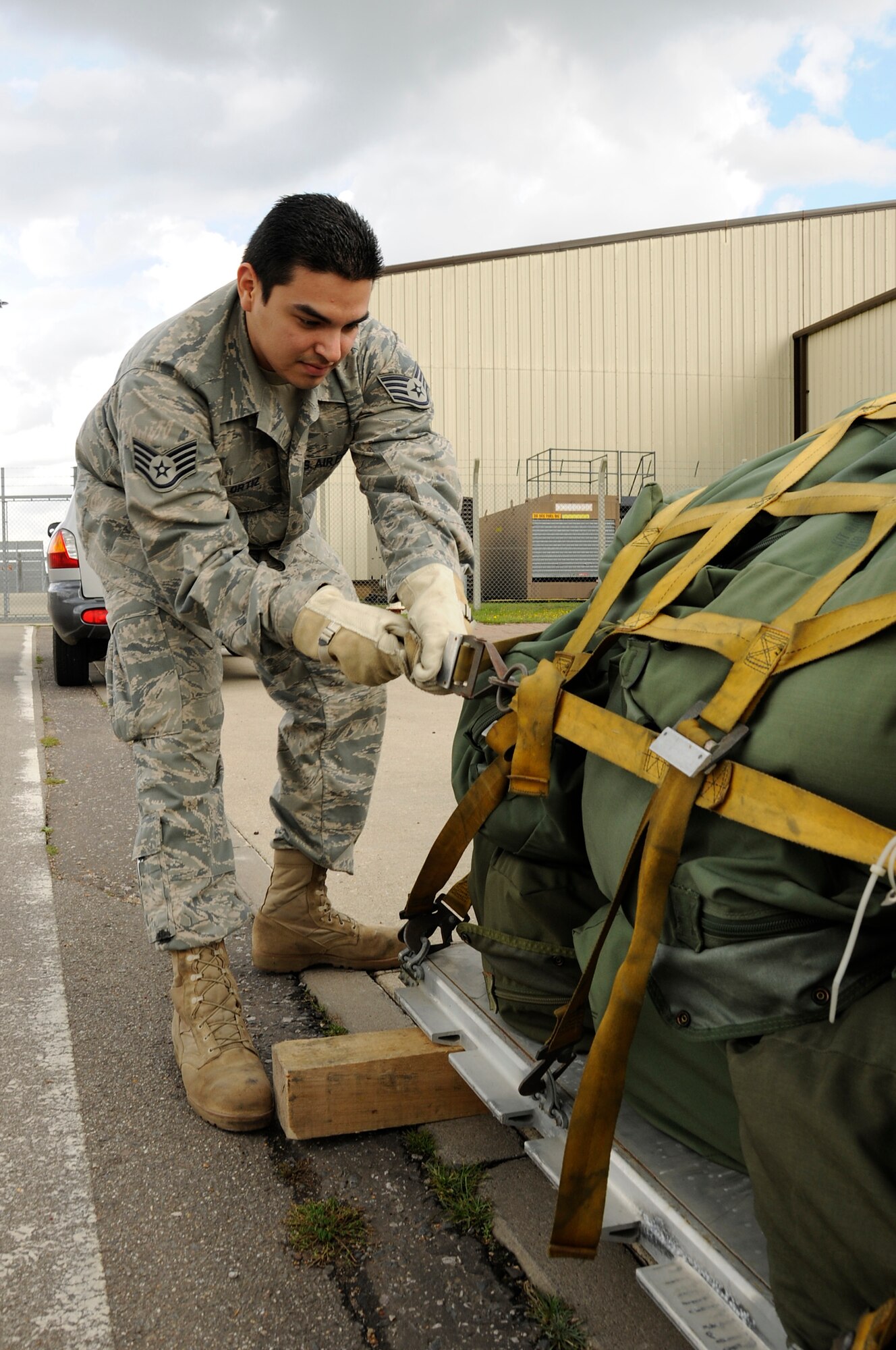 ROYAL AIR FORCE LAKENHEATH, England -- Staff Sgt. Mario Ortiz, 48th Logistics Readiness Squadron equipment manager, tightens a pallet outside the deployment center during an Operational Readiness Exercise on Sept. 7, 2010. Equipment is palletized for transportation to a simulated deployed location. (U.S. Air Force photo/Airman 1st Class Lausanne Morgan)