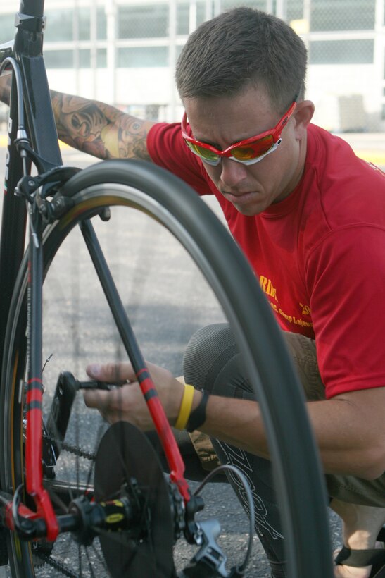 Gunnery Sgt. Chmielewski makes some final ajustments to the bikes before the teams sets off on the second day of the honor ride.