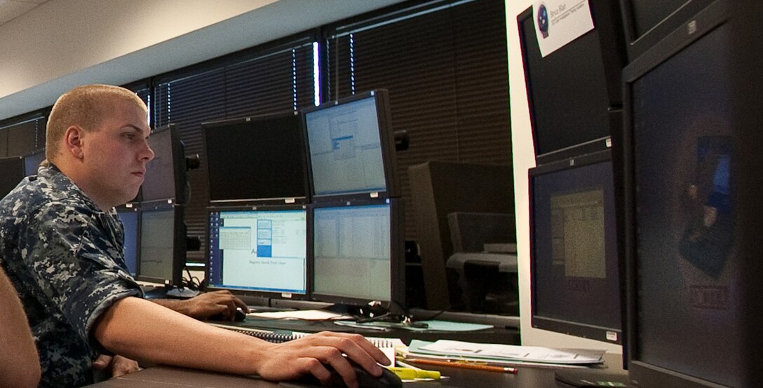 Petty Officer 2nd Class Bryce Blair listens to his instructors directions for Hash analysis in Windows forensic examinations using EnCase Sept. 9, 2010, at the Defense Cyber Investigations Training Academy in Linthicum, Md. Petty Officer Blair is from the Naval Criminal Investigative Service. (U.S. Air Force photo/Lance Cheung)
