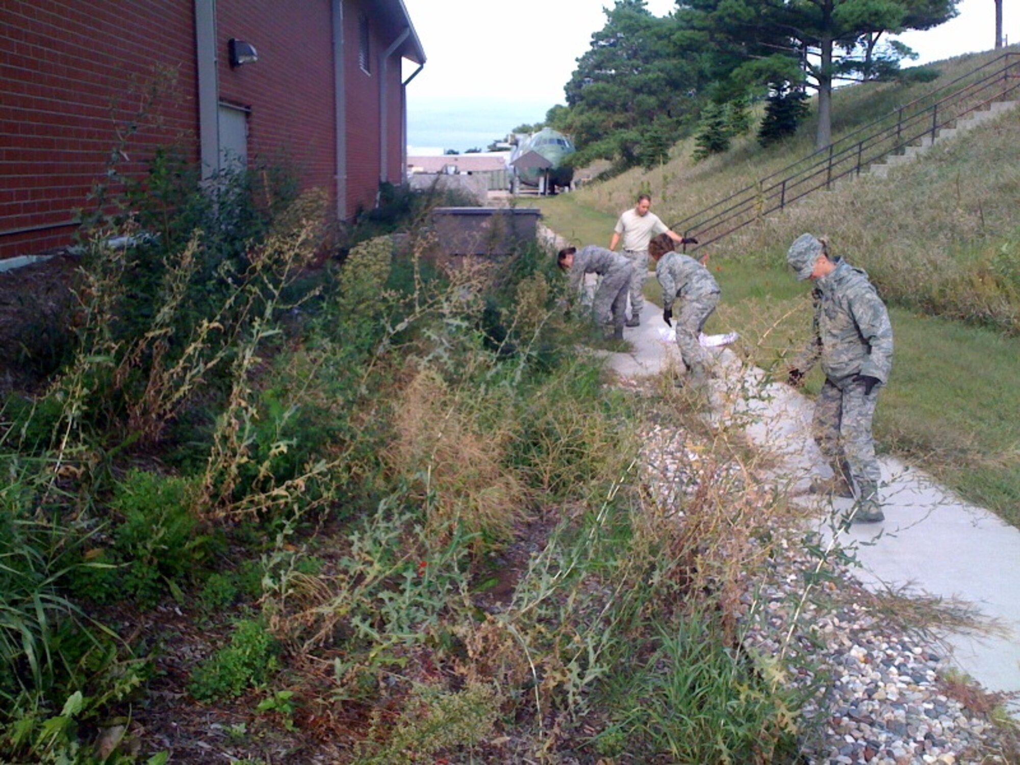 934th Aeromedical Evacuation Squadron members do some gardening during base clean up day Sept. 9. (Courtesy Photo)
