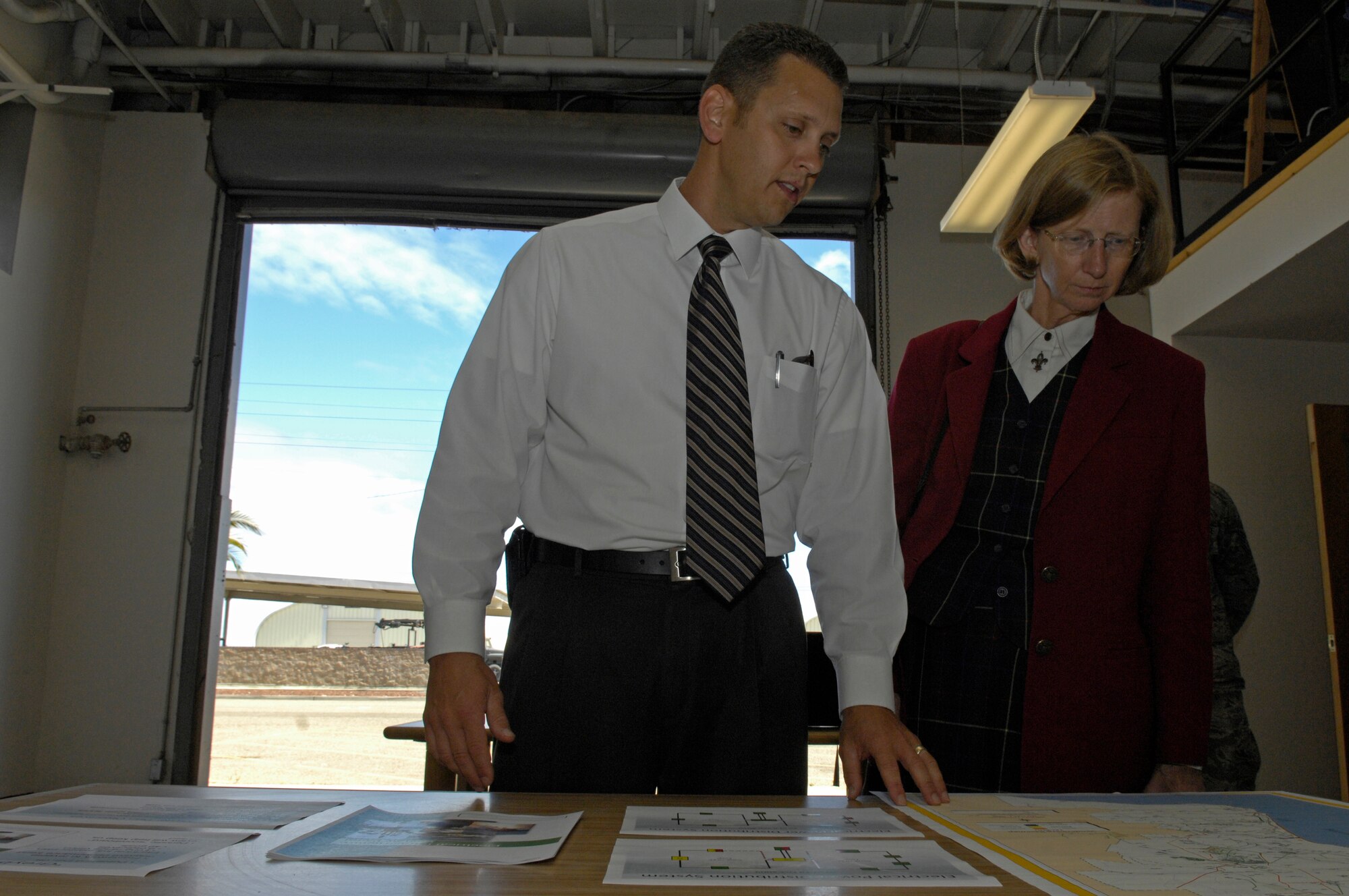 VANDENBERG AIR FORCE BASE, Calif. – At the 30th Civil Engineer Squadron’s Operations Support Flight, Chris Puckett, Director of Instillations and Logistics at the Air Force Space Command, and Lefty Pakulski, the 30th CES mission engineer chief, analyze a map of the base here Wednesday, Sept. 8, 2010. Ms. Puckett visited the installation to inform base leadership of a new tracking system. (U.S. Air Force photo/Airman 1st Class Lael Huss)